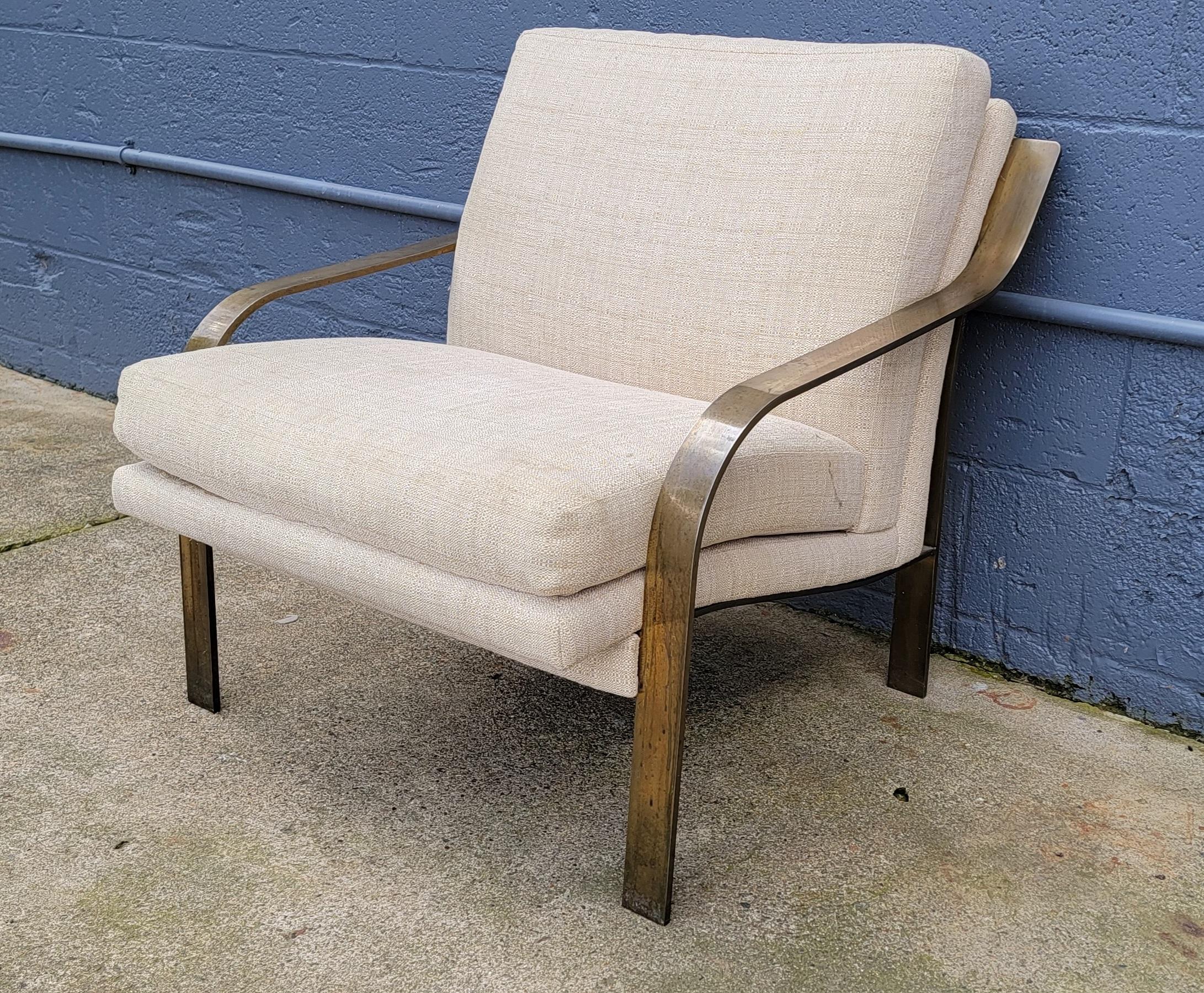 Unusual flat bar steel lounge chair designed in the manner of Milo Baughman. Fine quality craftsmanship, very sturdy and comfortable chair. Substantial, solid steel frame appears to have a brass plating. Discoloration (patina) to metal frame,