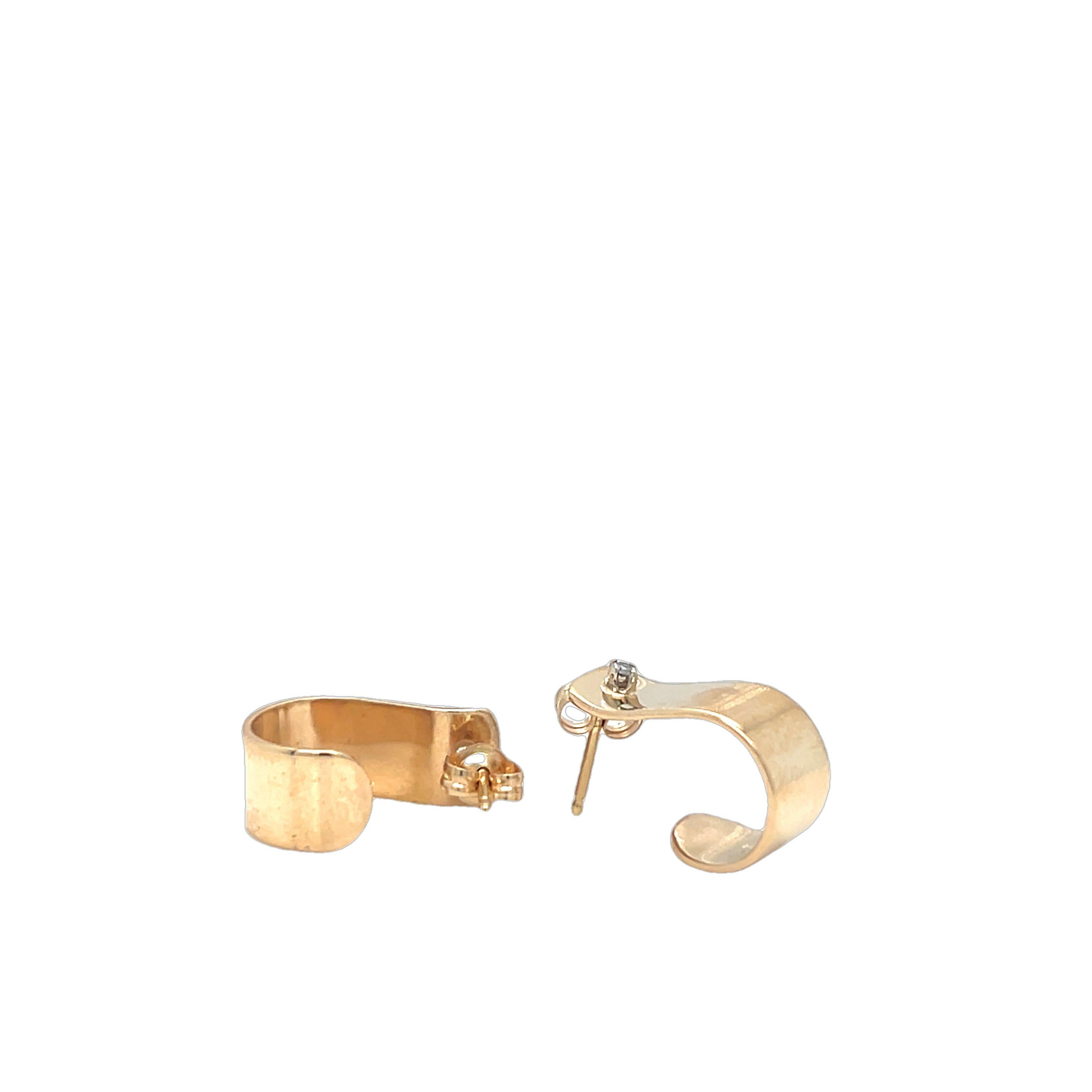 These earrings are perfect for minimalist styling, featuring a sleek curved shape and a high-polish finish. Each earring is adorned with a single cut diamond, adding a touch of elegance and sparkle. Designed with a secure post back, these earrings