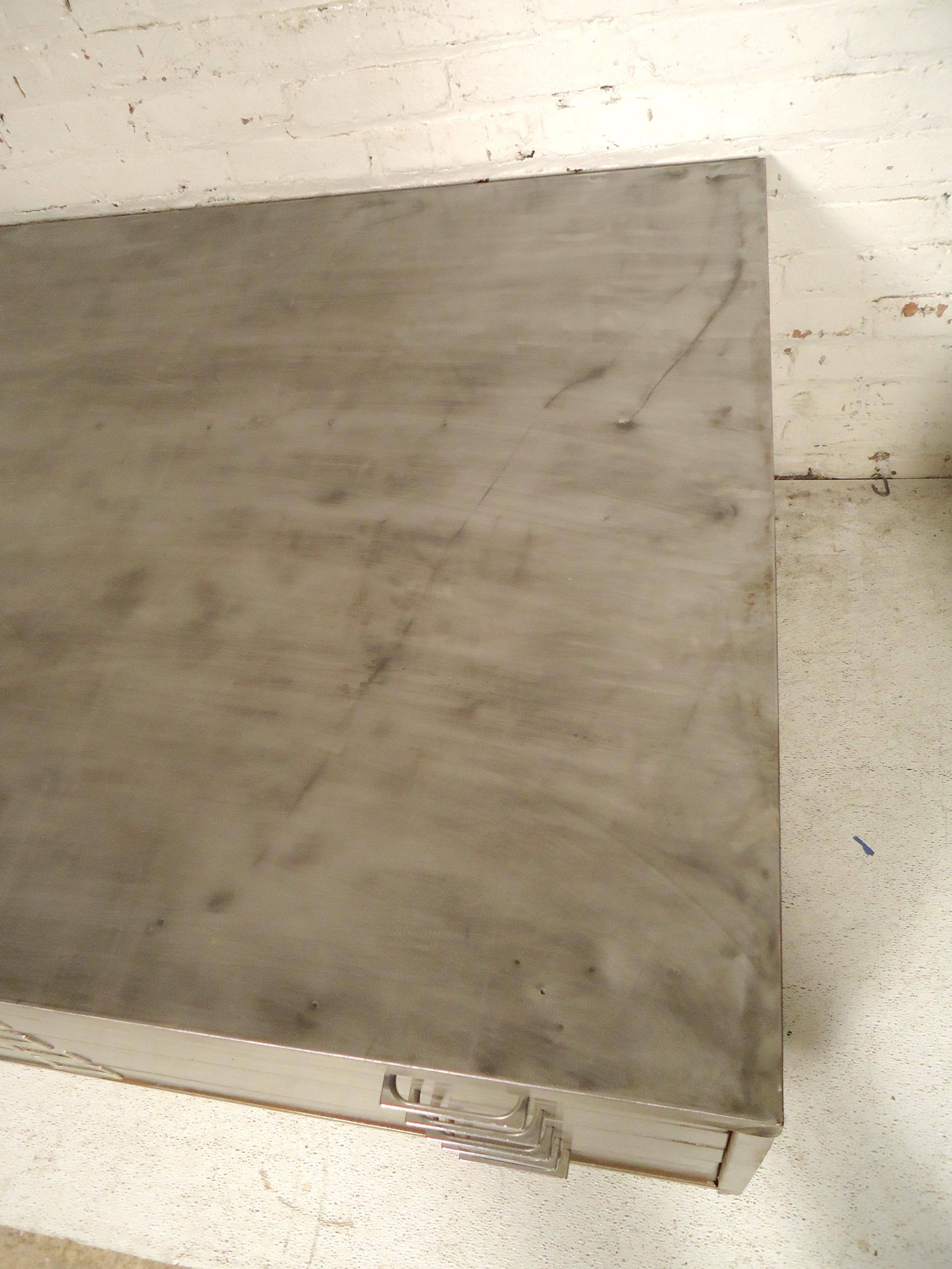 Large metal flat file set on swivel caster wheels. File has been redone to a bare metal style finish.
(Please confirm item location - NY or NJ - with dealer).
 