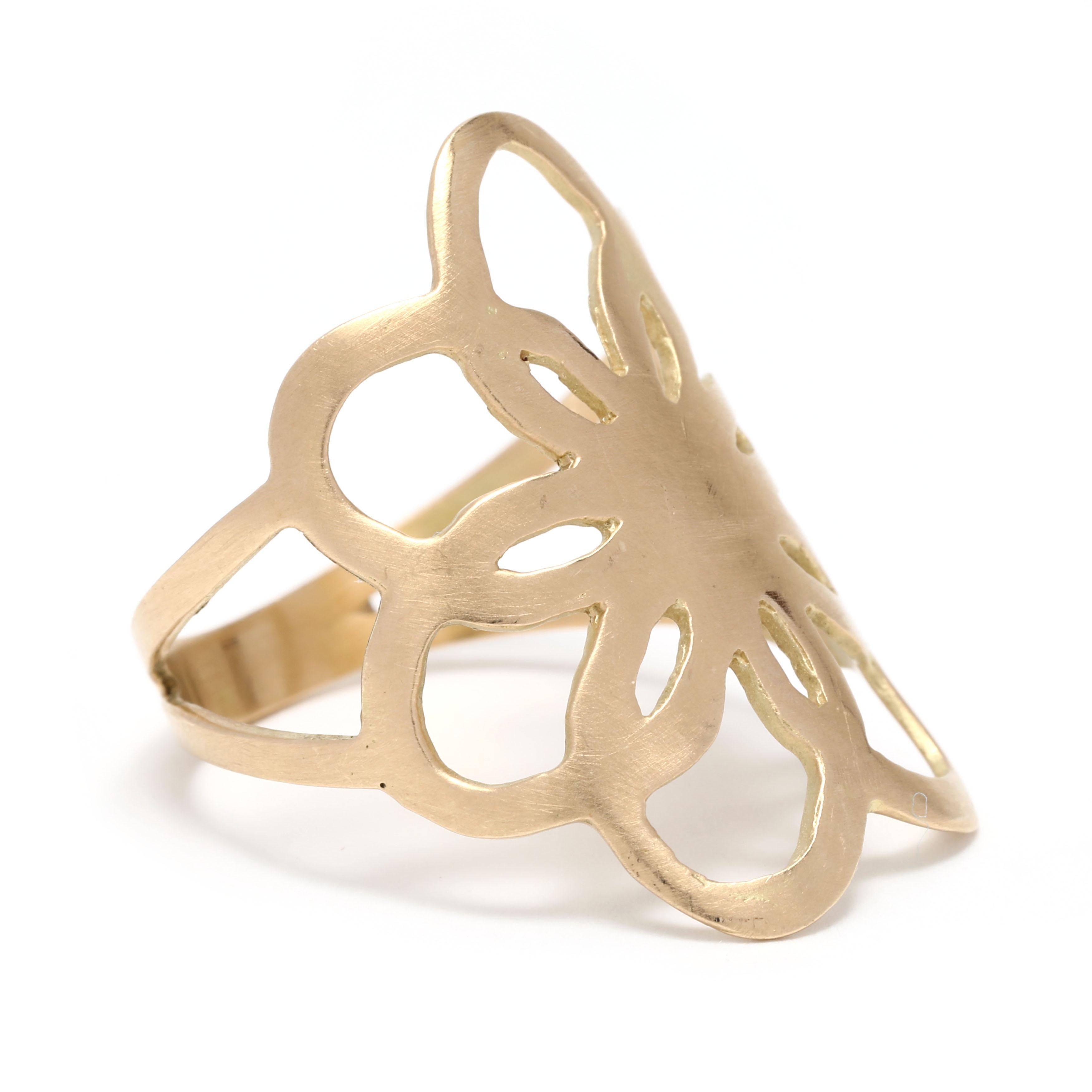 This 18K Yellow Gold Flat Flower Statement Ring offers an elegant and simple design that is perfect for everyday wear. The ring features a matte finish flower that is approximately 0.8 inches in diameter. The ring size is 7.25 and is the perfect