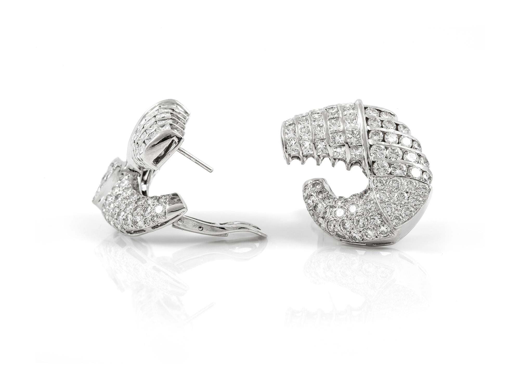 The earrings are finely crafted in 18k white gold with diamonds weighing approximately total of 11.00 carat.