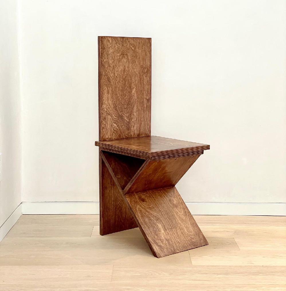 Flat pack chair by Goons
Dimensions: W 35 x D 40 x  H 95 cm
Materials: Wood.

Goons is located in Paris, France. All of their designs are made out of wood.