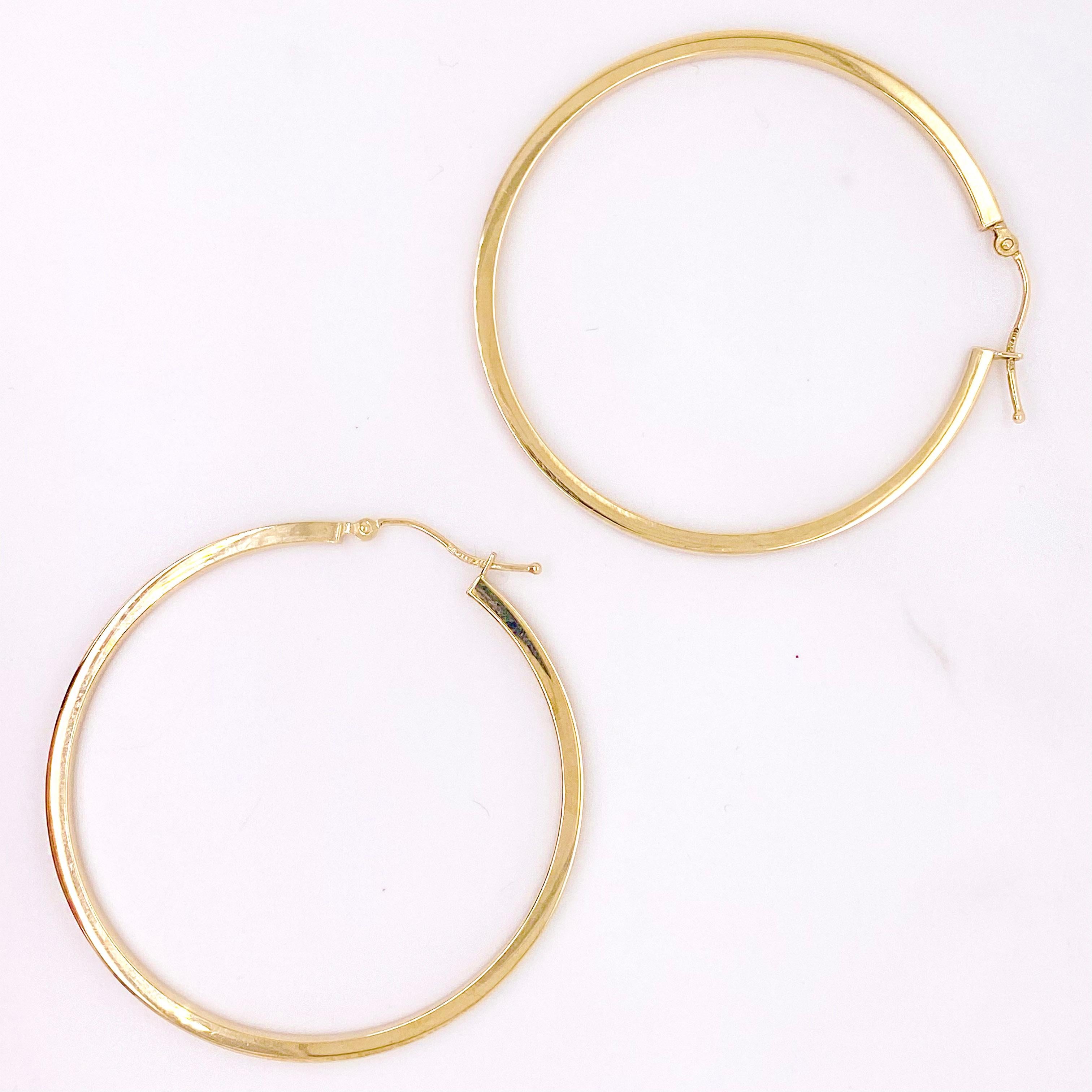 Gold hoop earrings are a staple in fine jewelry! These classic earrings are timeless and upgrade any outfit! The 14 karat yellow gold hoops are lightweight and comfortable to wear with a modern, flat edge design. They have a high polish finish and