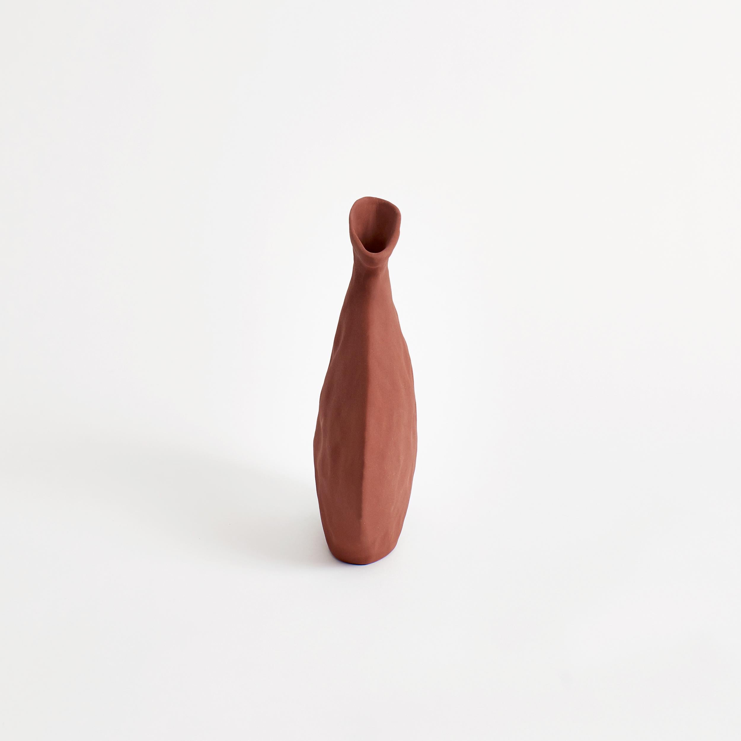 Flat vase in Brick.
Designed by Project 213A in 2021.
Handmade Stoneware.


Creation demands destruction, taking the old and the typical to conceive the new and particular. The Flat Vase represents the essence of this idiosyncrasy through its