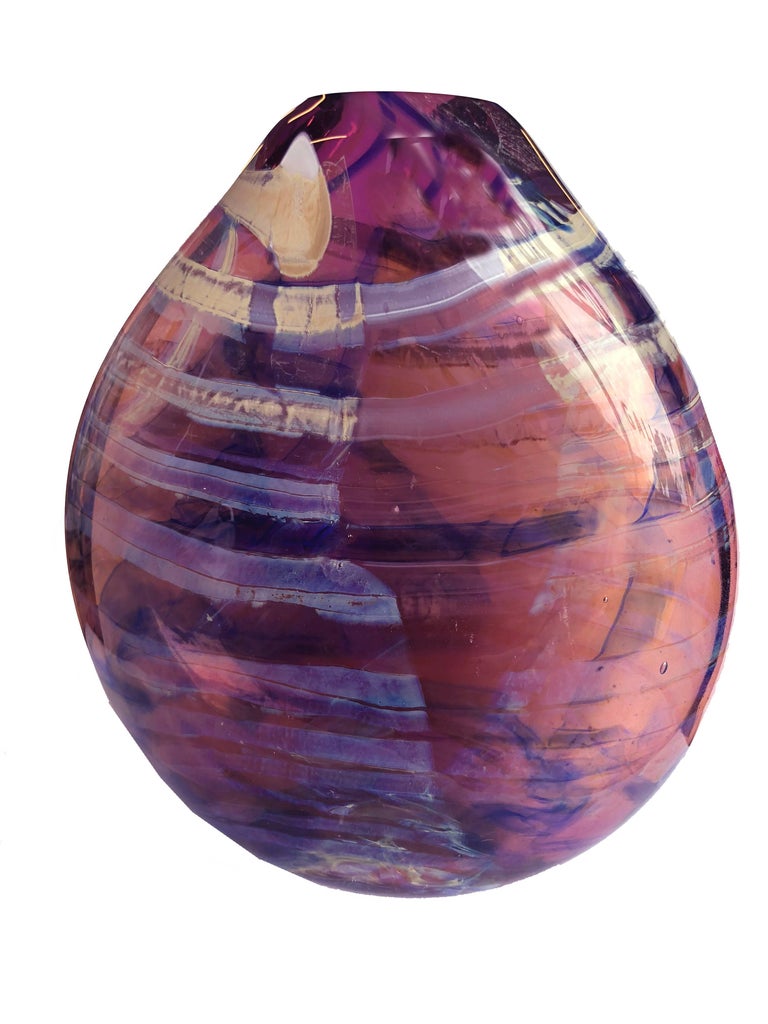 Contemporary Modern Purple Glass Flat Vase Vessel Sculpture, 1997 by Randi Solin 

Fluid ribbons of iridescent and Amethyst background with twists of bands of soft champagne towards the top, on dramatic display through the semi-clear Amethyst color