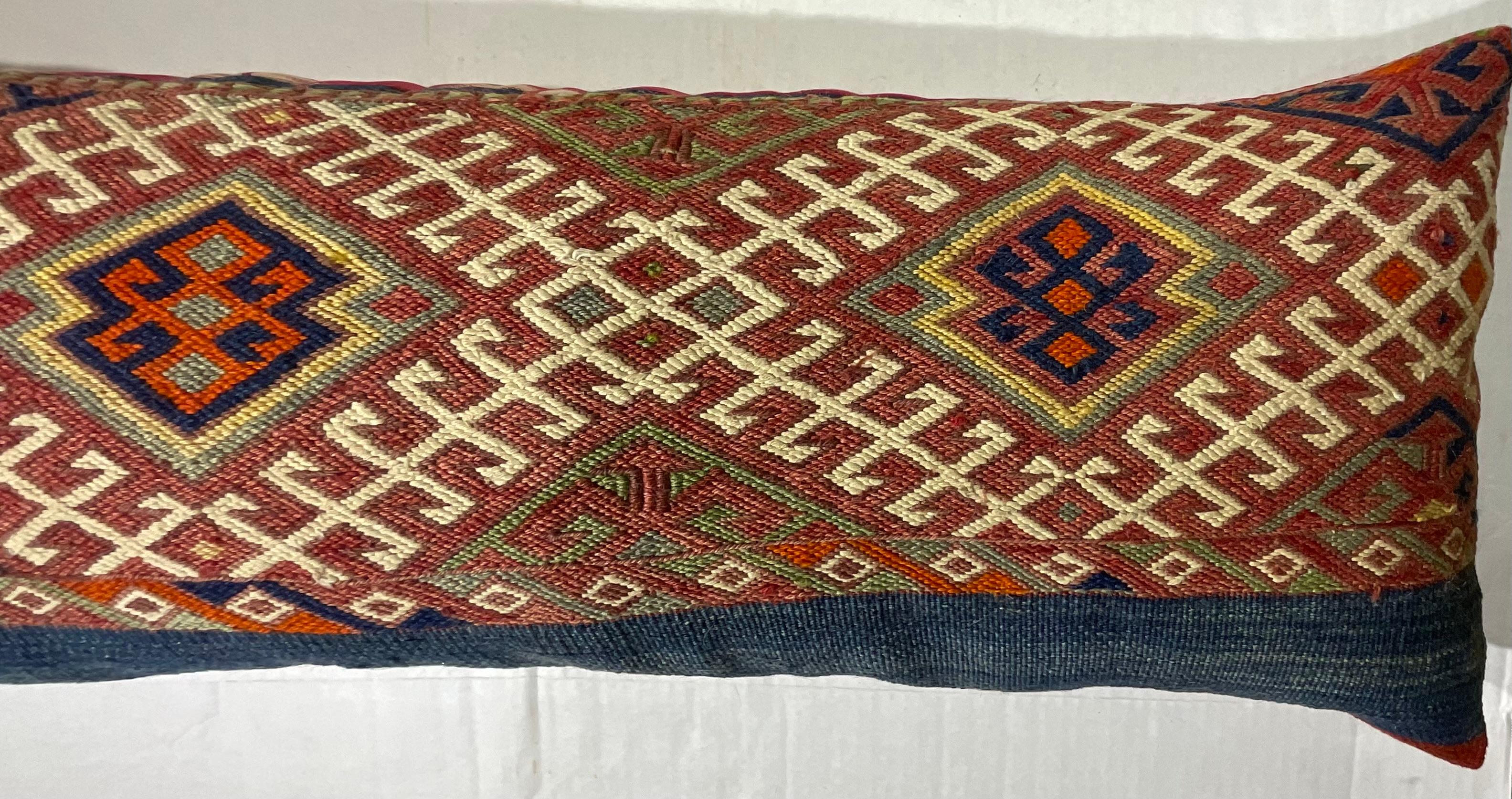 Beautiful pillow made of handwoven Kilim rug fragment, interesting geometric motif ,exceptional ikat print backing , with quality new insert.
The fragment was professionally clean before becoming pillow 
