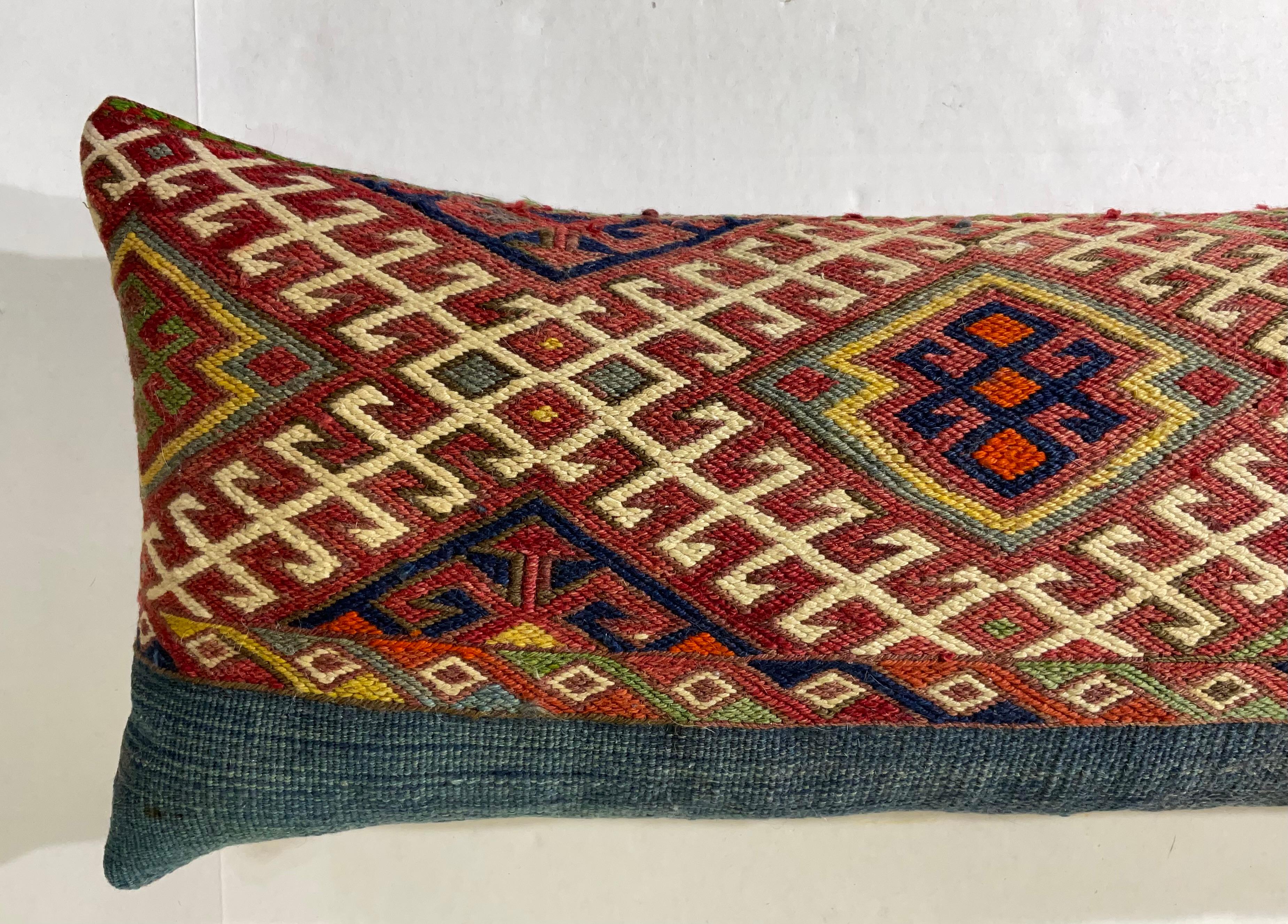 Beautiful pillow made of handwoven Kilim rug fragment, interesting geometric motif ,exceptional ikat print backing , with quality new insert.
The fragment was professionally clean before becoming pillow 
