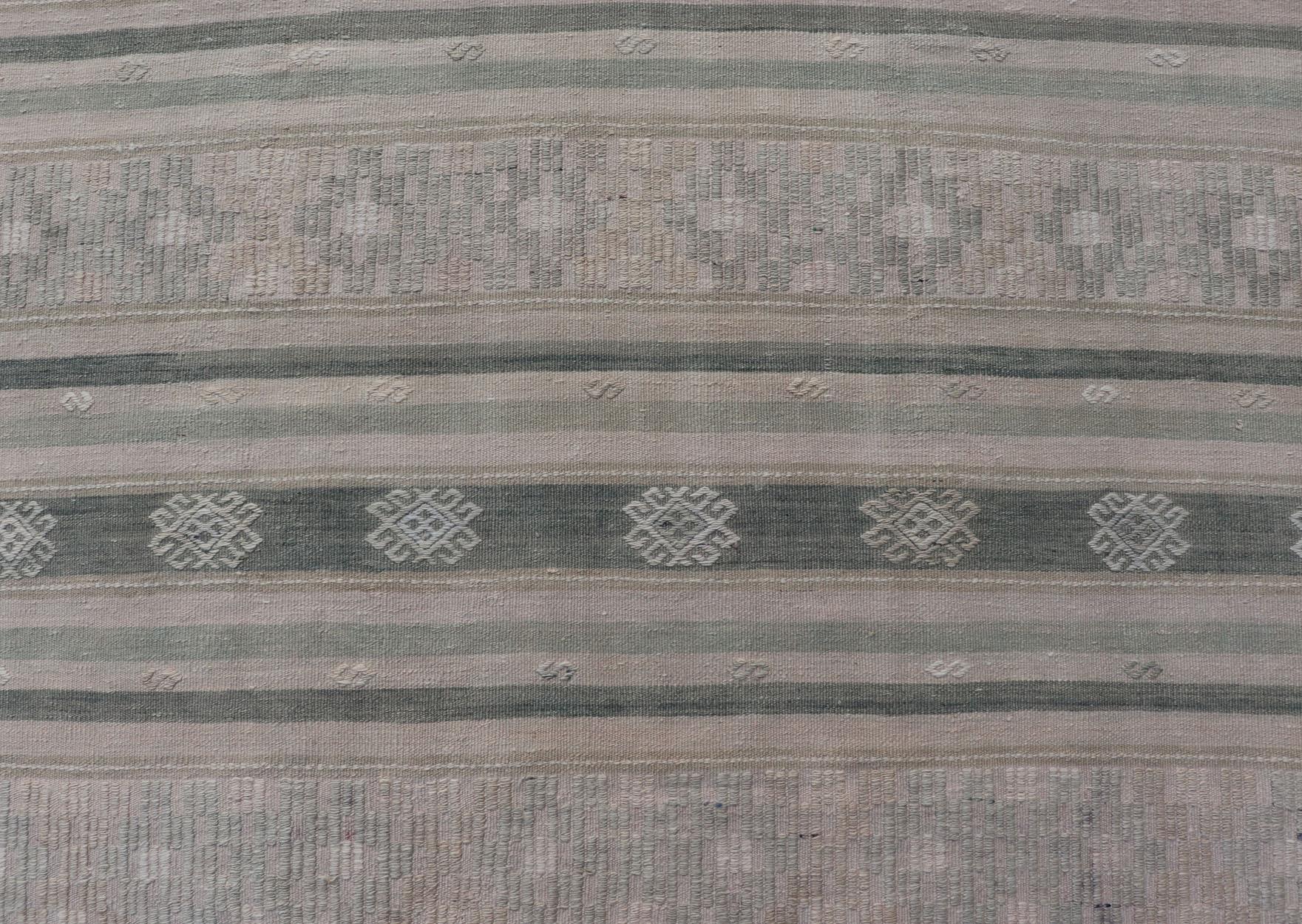 Measures: 5'9 x 9'0 
Flat-Weave Hand Woven Kilim with Embroideries in Taupe, Tan, Blue and Gray. Keivan Woven Arts / rug EN-14083, country of origin / type: Turkey / Kilim, circa 1950

This vintage Turkish Kilim rug features a contemporary geometric