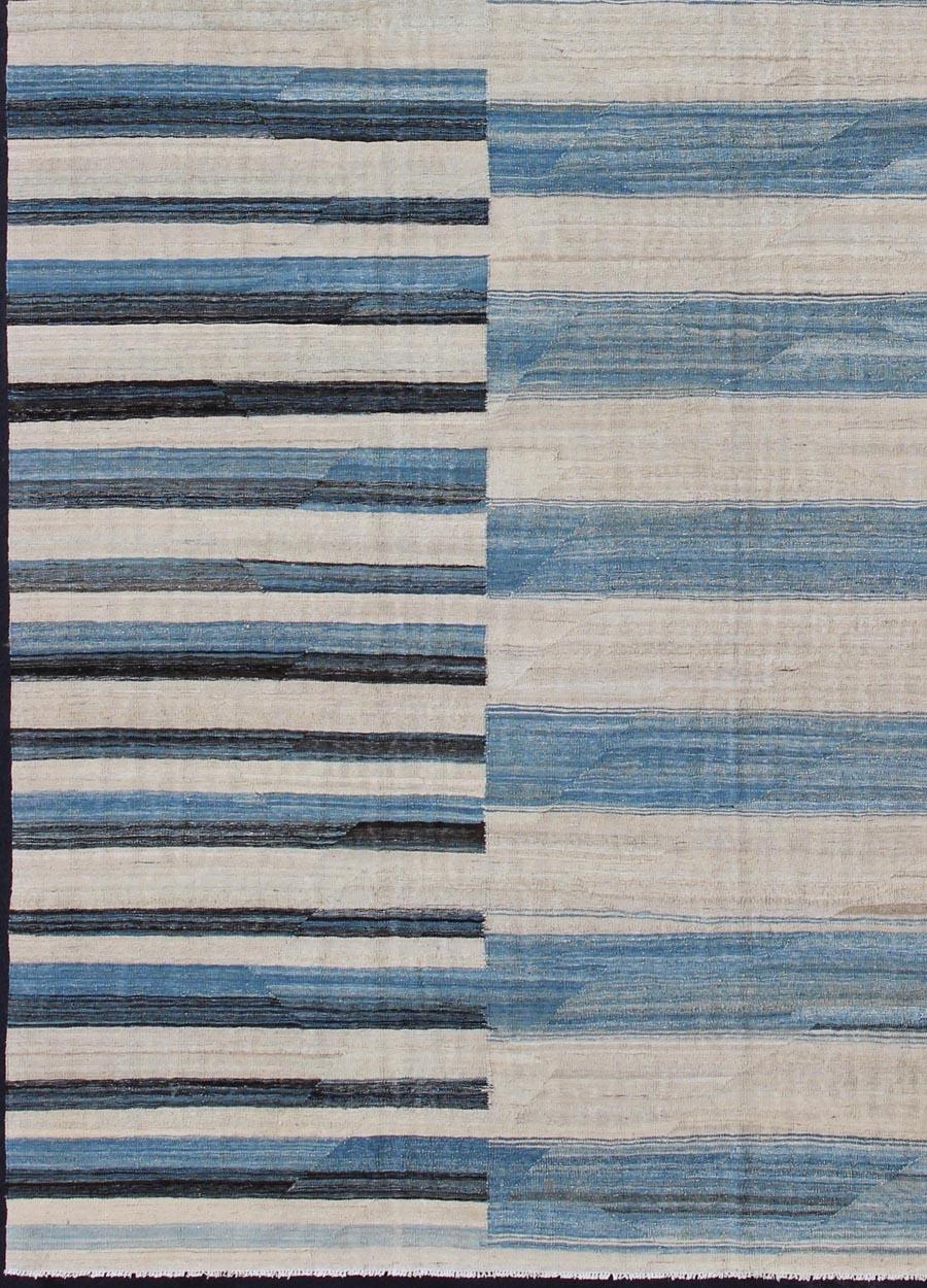 Modern flat-weave kilim rug with stripes in shades of light blue, charcoal, taupe gray and ivory, rug afg-6424, country of origin / type: Afghanistan / Kilim

This flat-woven kilim rug features a classic stripe design that places seamlessly in any