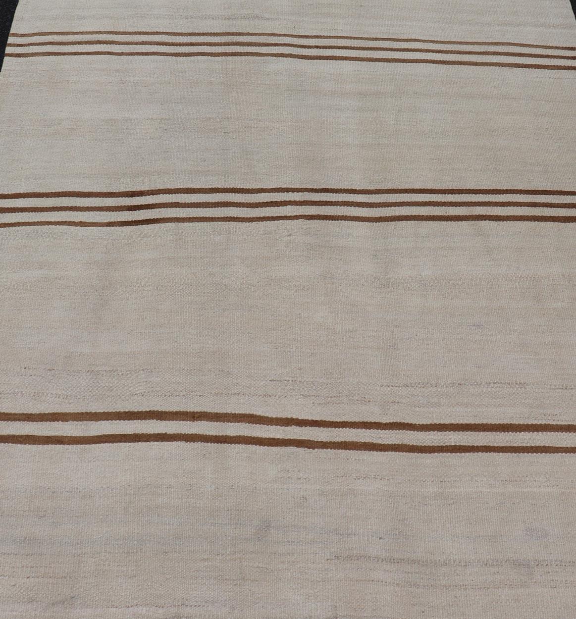 Flat-Weave Kilim Vintage Rug Turkey with Horizontal Stripes in Ivory & Brown. Keivan Woven Arts /  rug EN-13711, country of origin / type: Turkey / Kilim, circa 1950
Measures: 4'10 x 5'9 
This vintage flat-woven Kilim features a minimalist design