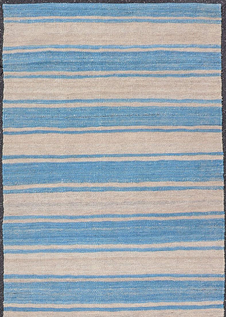 Flat-weave Kilim rug with stripes with modern design in shades of blue and gray, rug AFG-81, Keivan Woven Arts / country of origin / type: Afghanistan / Kilim

This playful piece features a Classic stripe design that evokes casual and easy vibes.