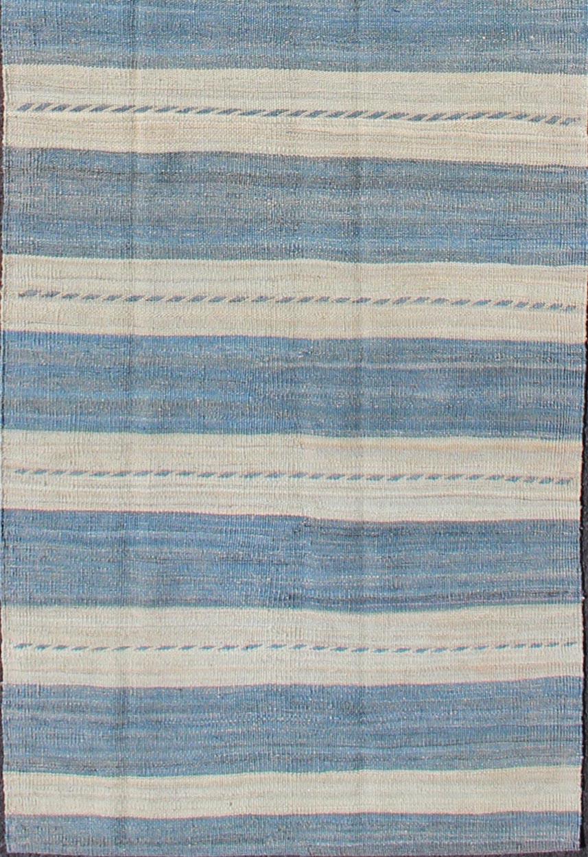 Flat-weave Kilim rug with stripes with modern design in shades of blue and ivory, rug afg-27712, country of origin / type: Afghanistan / Kilim

This playful piece features a Classic stripe design that evokes casual and easy vibes. Perfect for