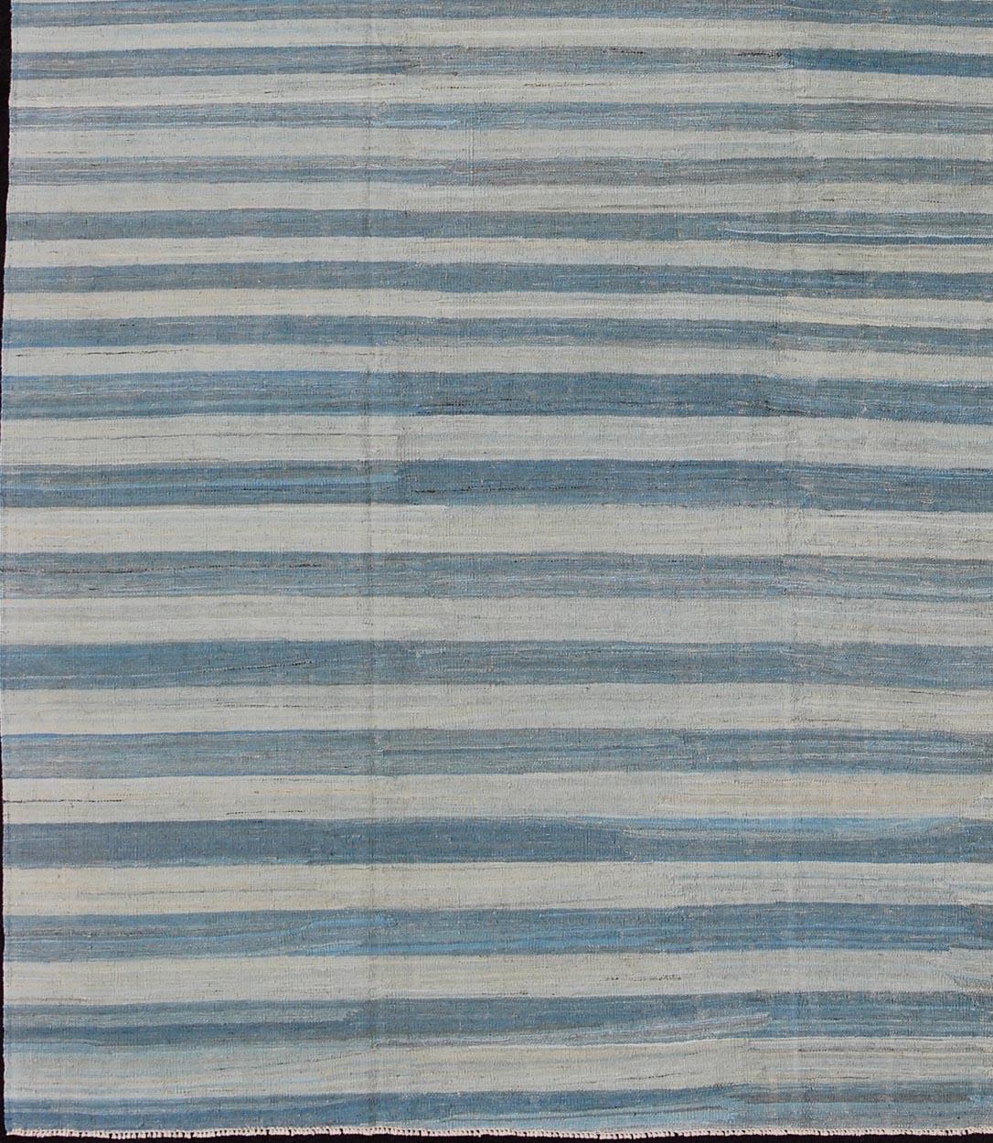 Flat-weave Kilim rug with stripes with modern design in shades of blue, taupe gray and ivory, rug afg-15288, country of origin / type: Afghanistan / Kilim

This playful piece features a Classic stripe design that evokes casual and easy vibes.
