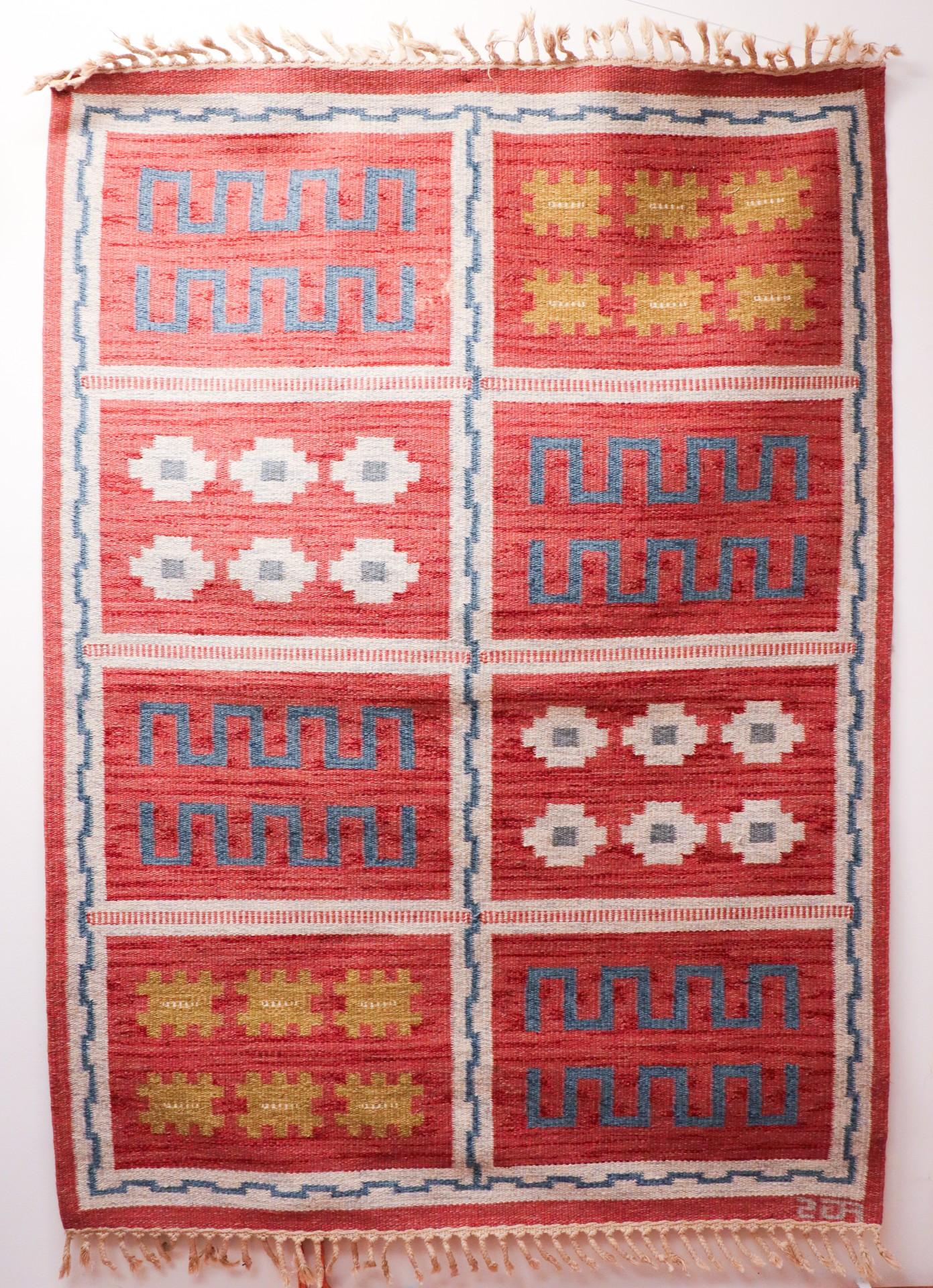 A vintage Swedish flat-weave by Anna-Greta Sjöqvist from the mid 20th century. It is 205 x 146 cm and in very good condition except from some minor stains and shows wear on the fringes. It is marked with her initial AGS. 