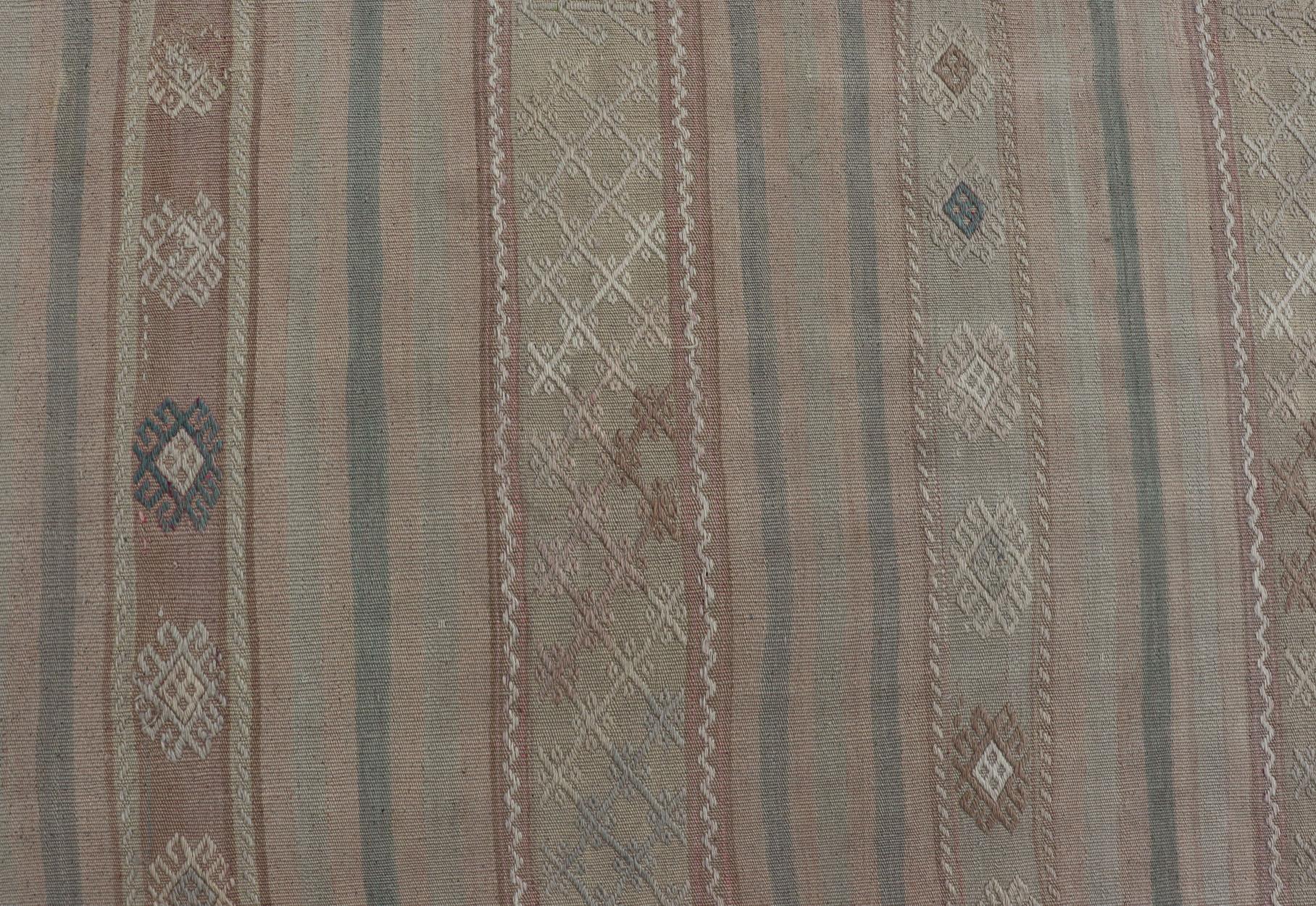 Flat-Weave Turkish Kilim with Embroideries in Earthy Tones and Hints of Pink. 
geometric stripe design Vintage Kilim from Turkey. Keivan Woven Arts / rug EN-179255, country of origin / type: Turkey / Kilim, circa 1950

This vintage flat-woven