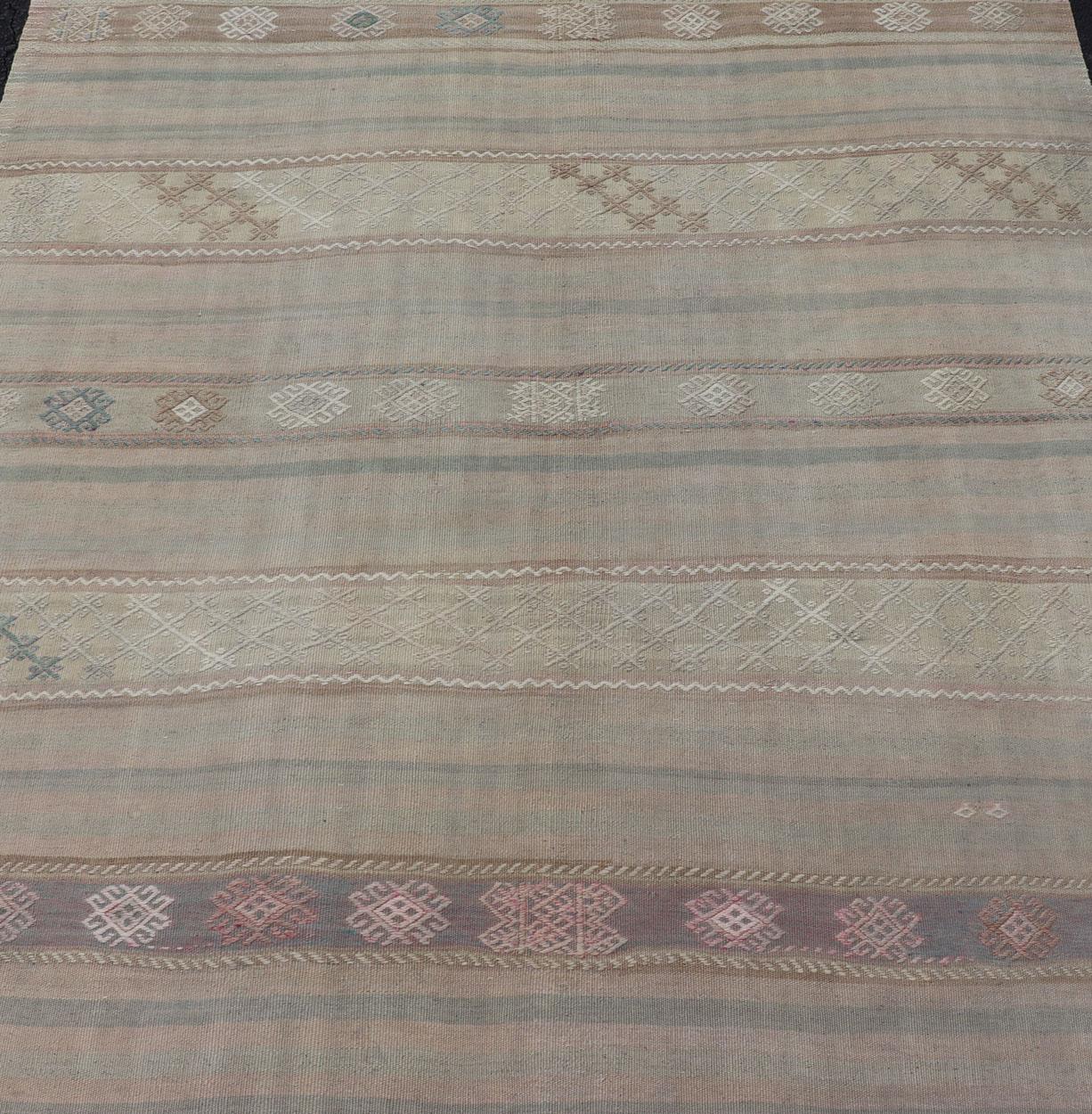 Hand-Woven Flat-Weave Turkish Kilim with Embroideries in Earthy Tones and Hints of Pink For Sale