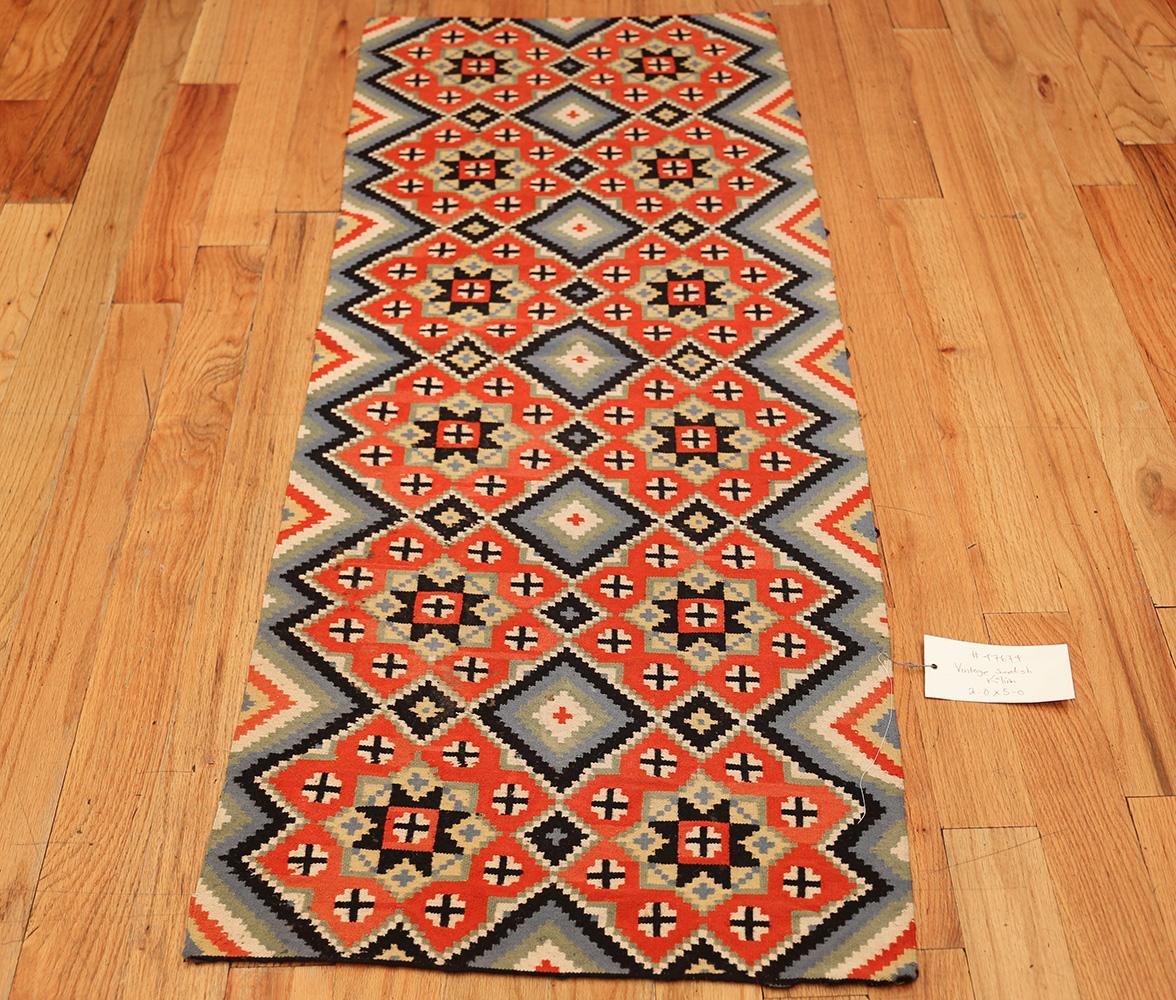 Vintage Swedish flat-weave, country of origin: Scandinavia, circa mid-20th century. Here is a fascinating, breath-taking Mid-Century Modern rug – a Scandinavian vintage Swedish kilim rug that was designed and woven by the accomplished rug makers of
