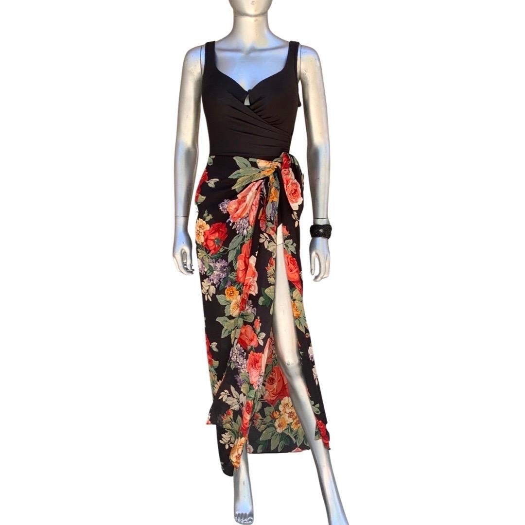 This is one of the most flattering and beautifully designed swimsuit we have ever seen on! A “Miracle Suit” draped and shaped to perfection. Size 8. Made in Columbia. It has a gorgeous silk floral print sarong/scarf that has a hand rolled edges.