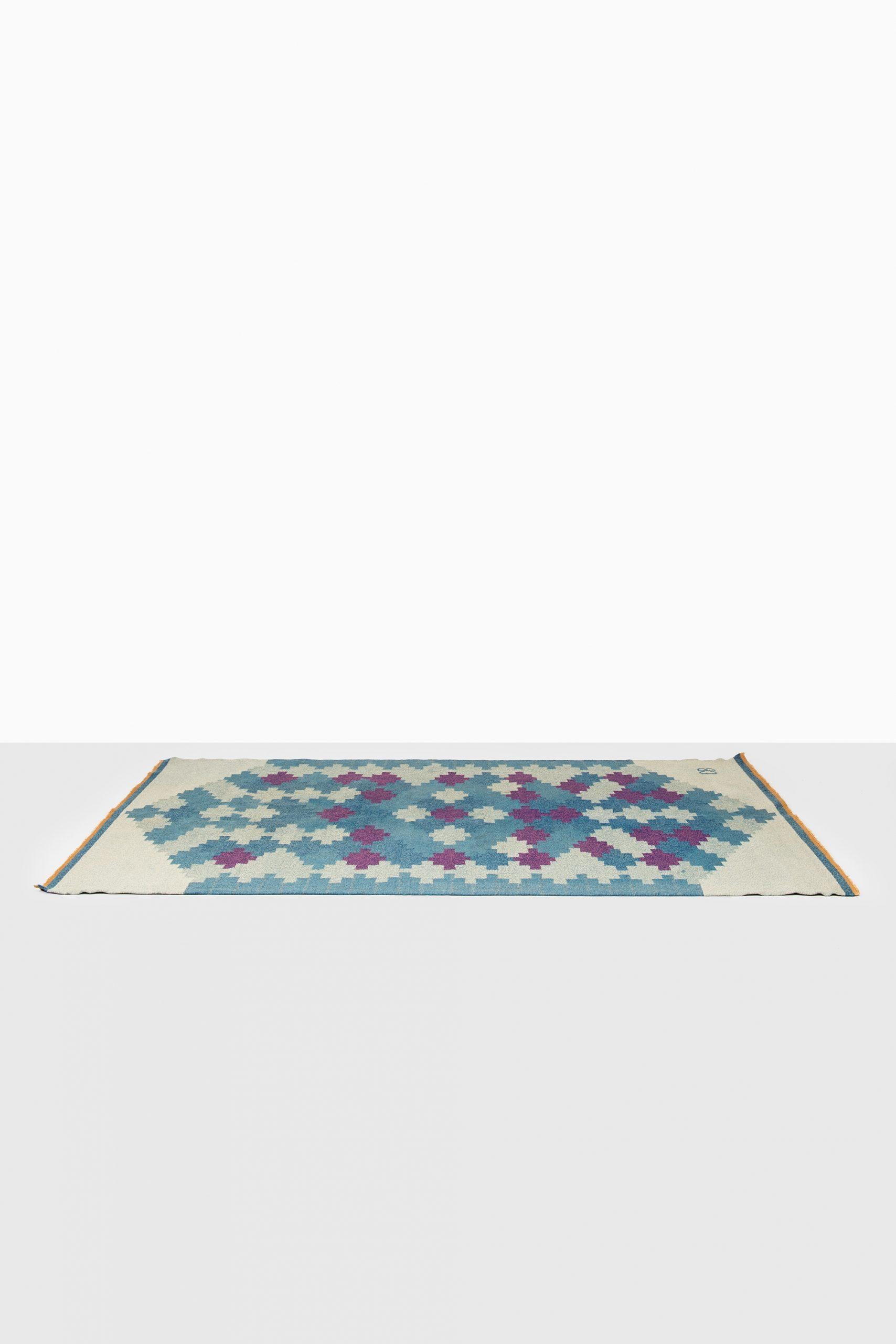 Large midcentury flat-weave carpet designed by unknown designer. Produced in Sweden. Signed CB.
  