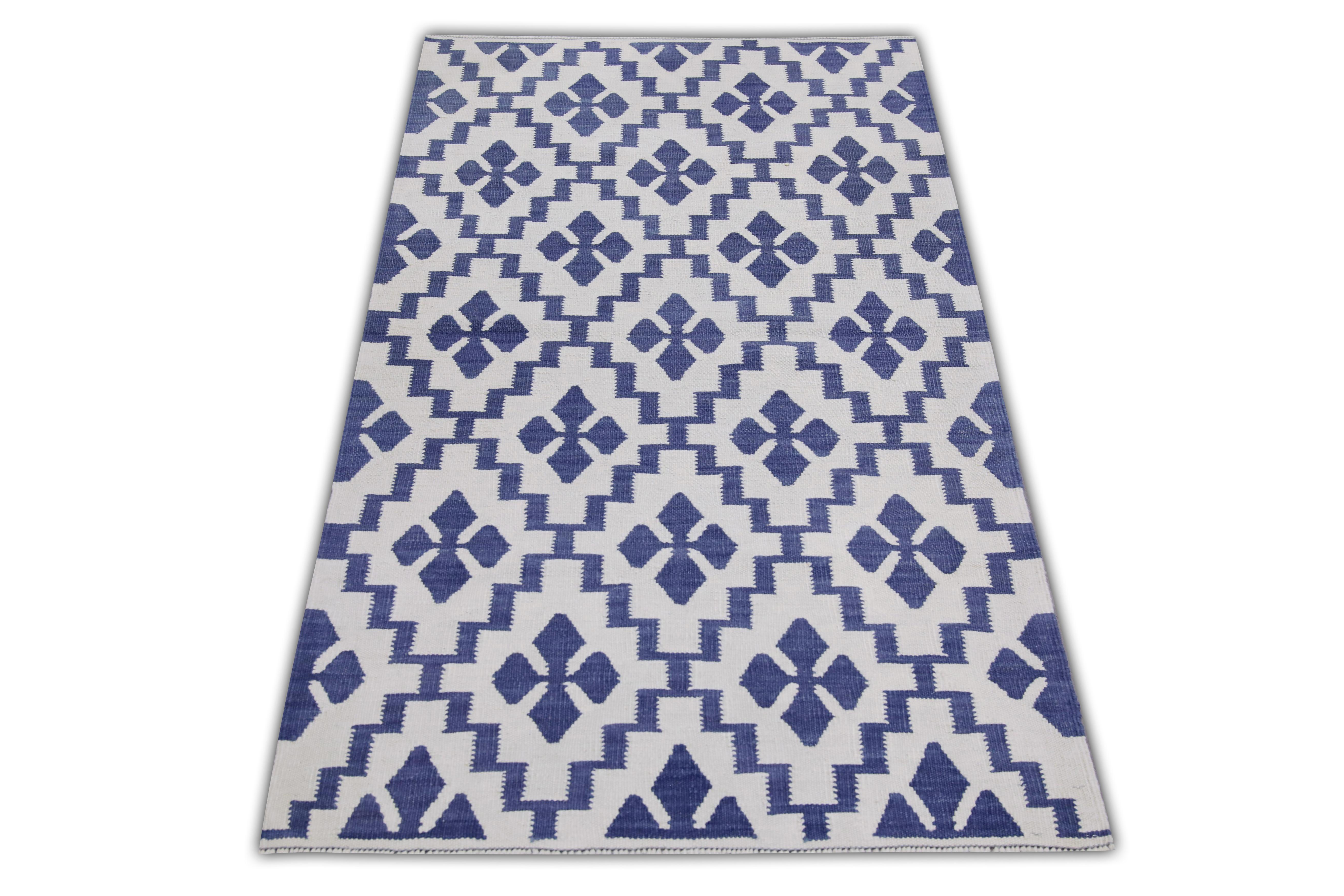 This exquisite Turkish flatweave kilim rug is a stunning masterpiece of traditional craftsmanship. Each rug is meticulously handwoven by skilled artisans using age-old techniques that have been passed down through generations. The intricate design
