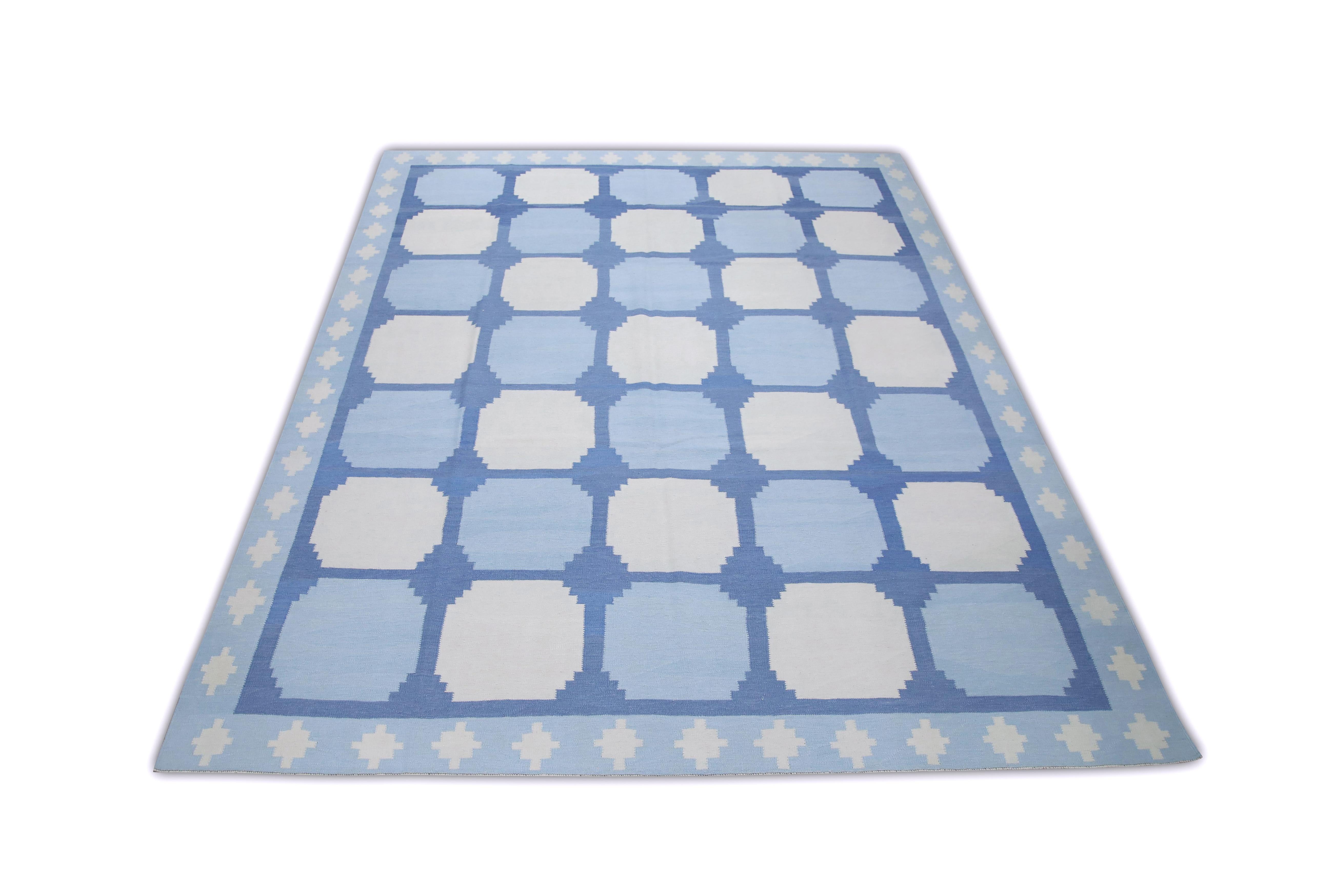 This exquisite Turkish flatweave kilim rug is a stunning masterpiece of traditional craftsmanship. Each rug is meticulously handwoven by skilled artisans using age-old techniques that have been passed down through generations. The intricate design