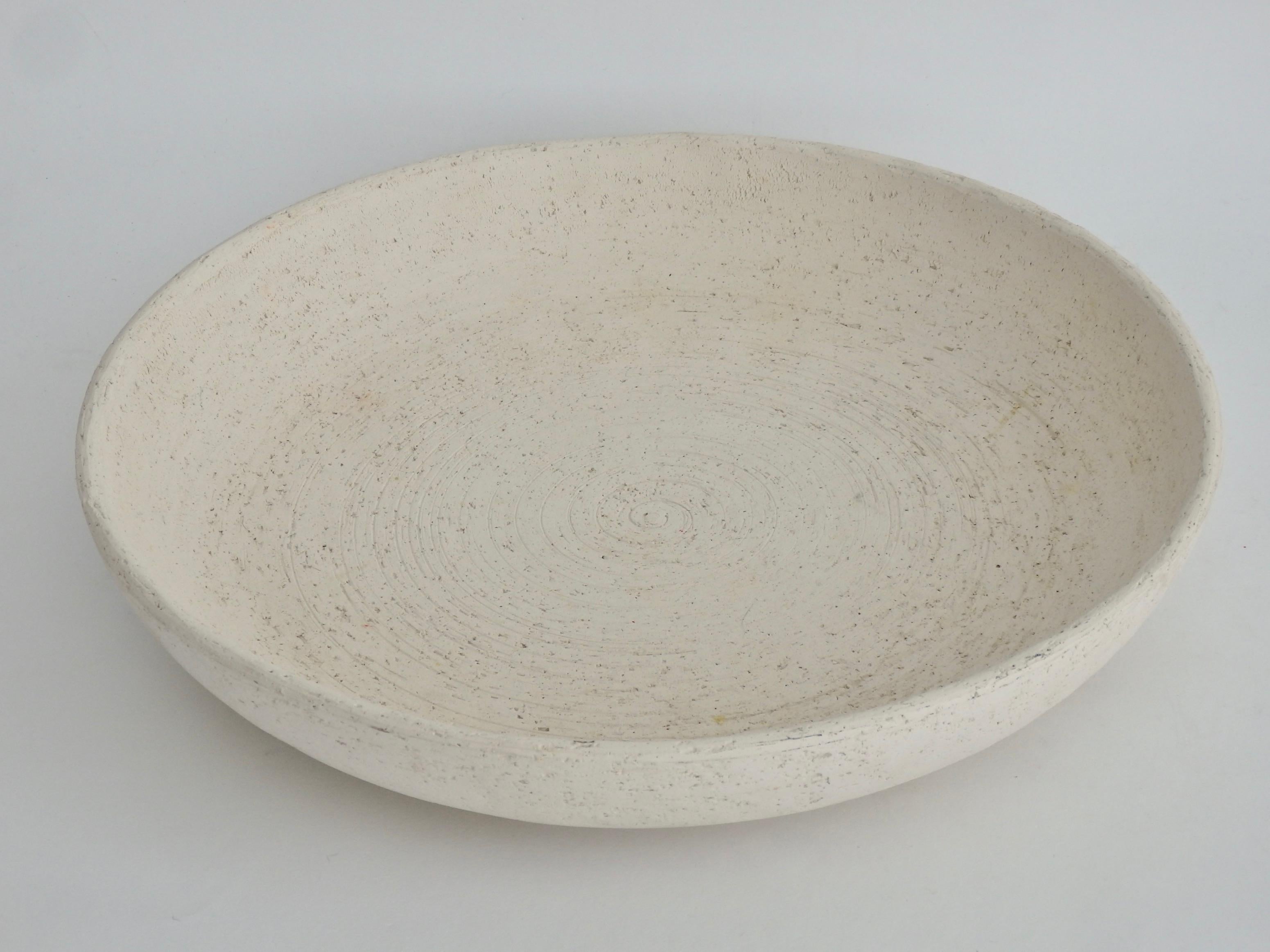 A timely and classic Flavia Montelupo Italian fruit bowl in parchment white. An unglazed, earthenware terracotta bowl that is porous by nature giving a textural look and feel.
Founded in 1921 by Guido Bitossi, Montelupo was under the artistic