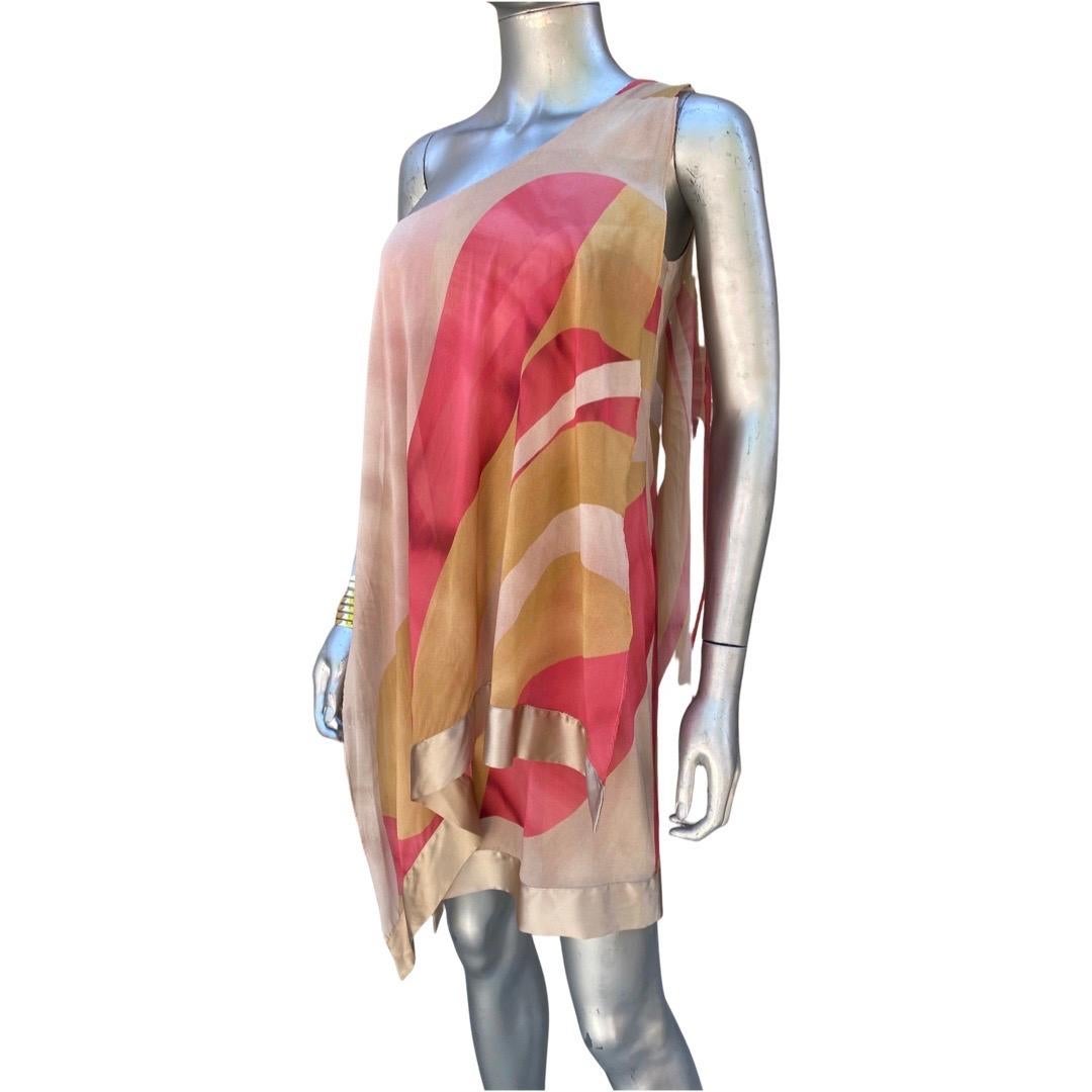A perfect modern spring/summer silk dress. This one, new with tags, has been stored in a Palm Springs Fashionista’s closet since purchased in Florence, Italy where the designer has a boutique. A beautifully colored abstract silk print overlayed like