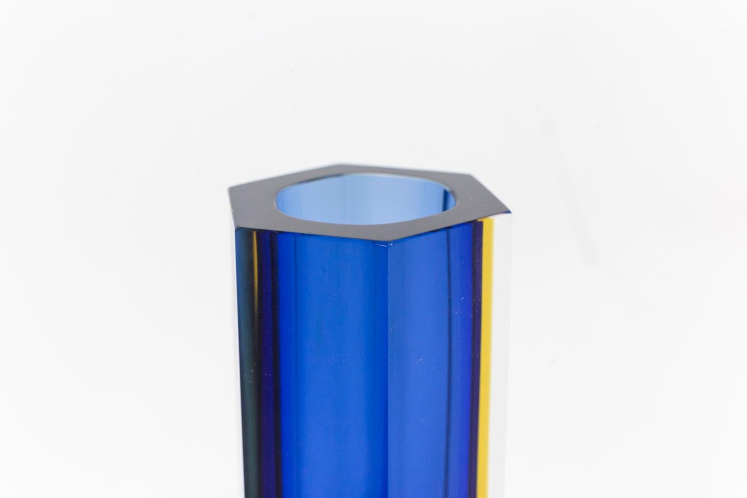 Flavio Poli, attributed to.
Luigi Mandruzzato, edited by. 

Murano vase of conical shape with geometric facets, blue and yellow color.

Italian work realized in the 1950s. 
 