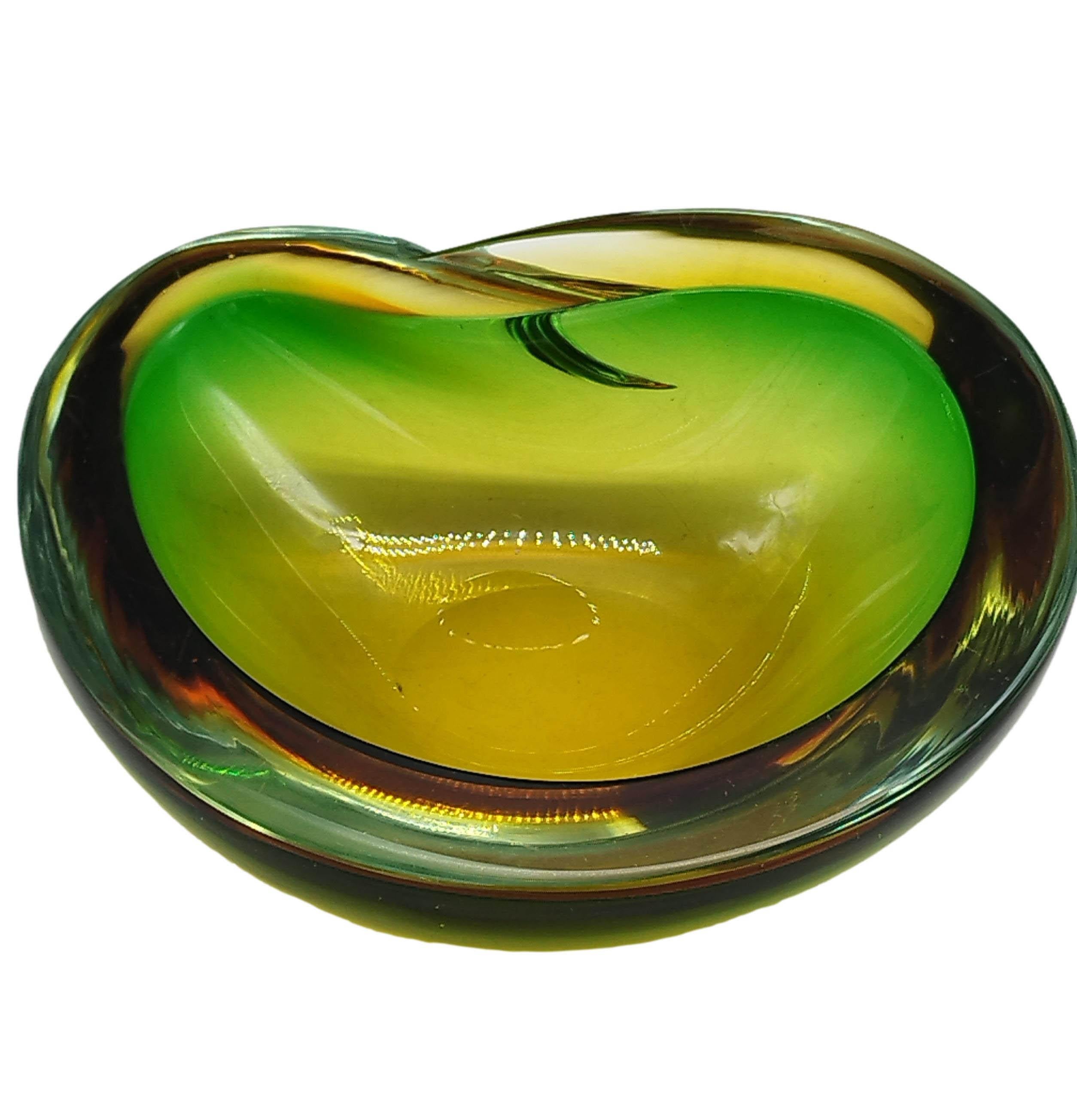 Yellow, amber and green coloured Murano glass centrepiece in Flavio Poli's Sommerso style. The work is in the typical ear shape often found in Murano bowls of the period. The object is not signed, like most pieces of that period, but shows great