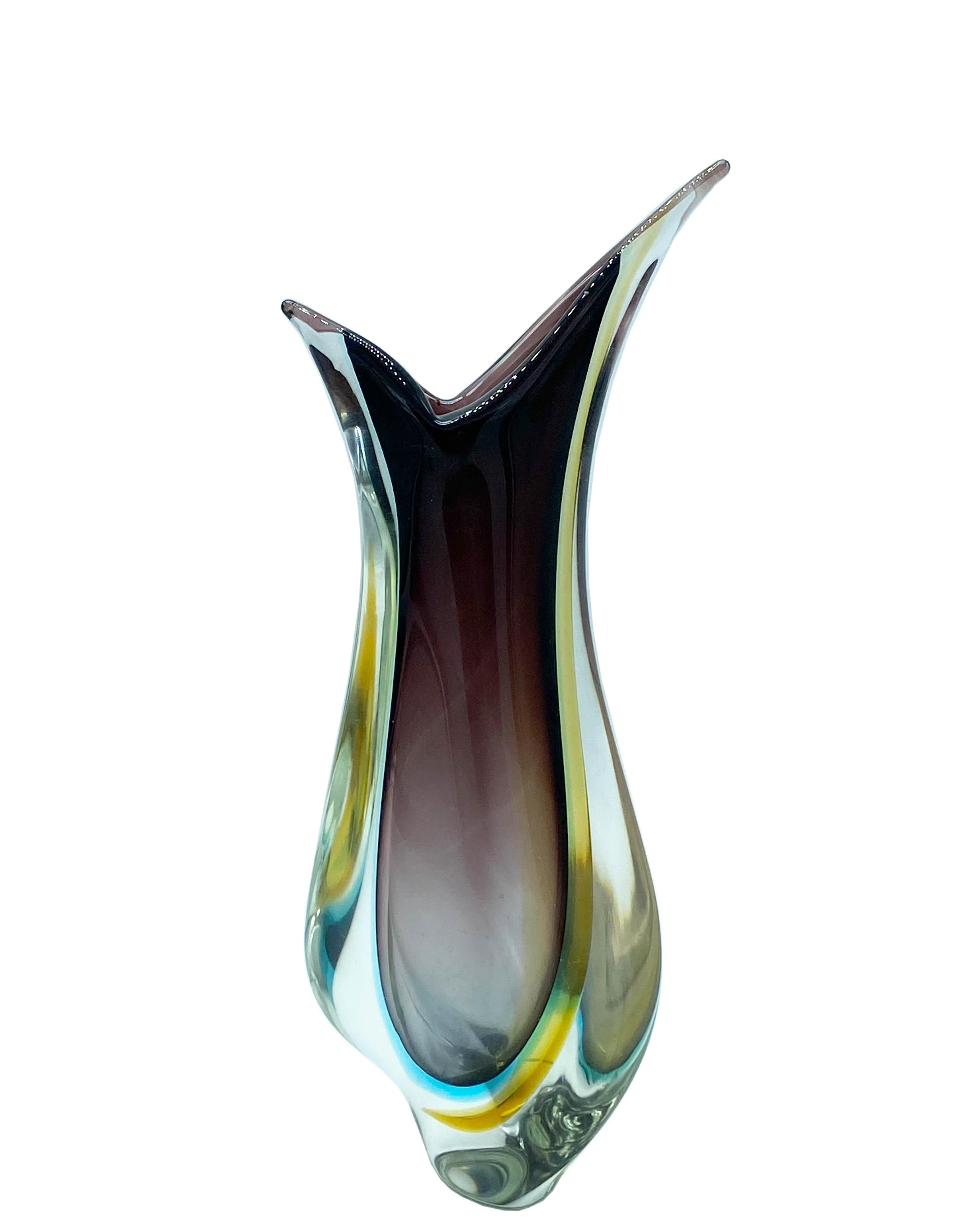 Glass vase by Flavio Poli for Seguso 1950. Made on the island of Murano, Venice, Italy. In a beautiful combination of purple glass encased in glass , which is further enclosed in clear glass, using the renowned Venetian sommerso technique.