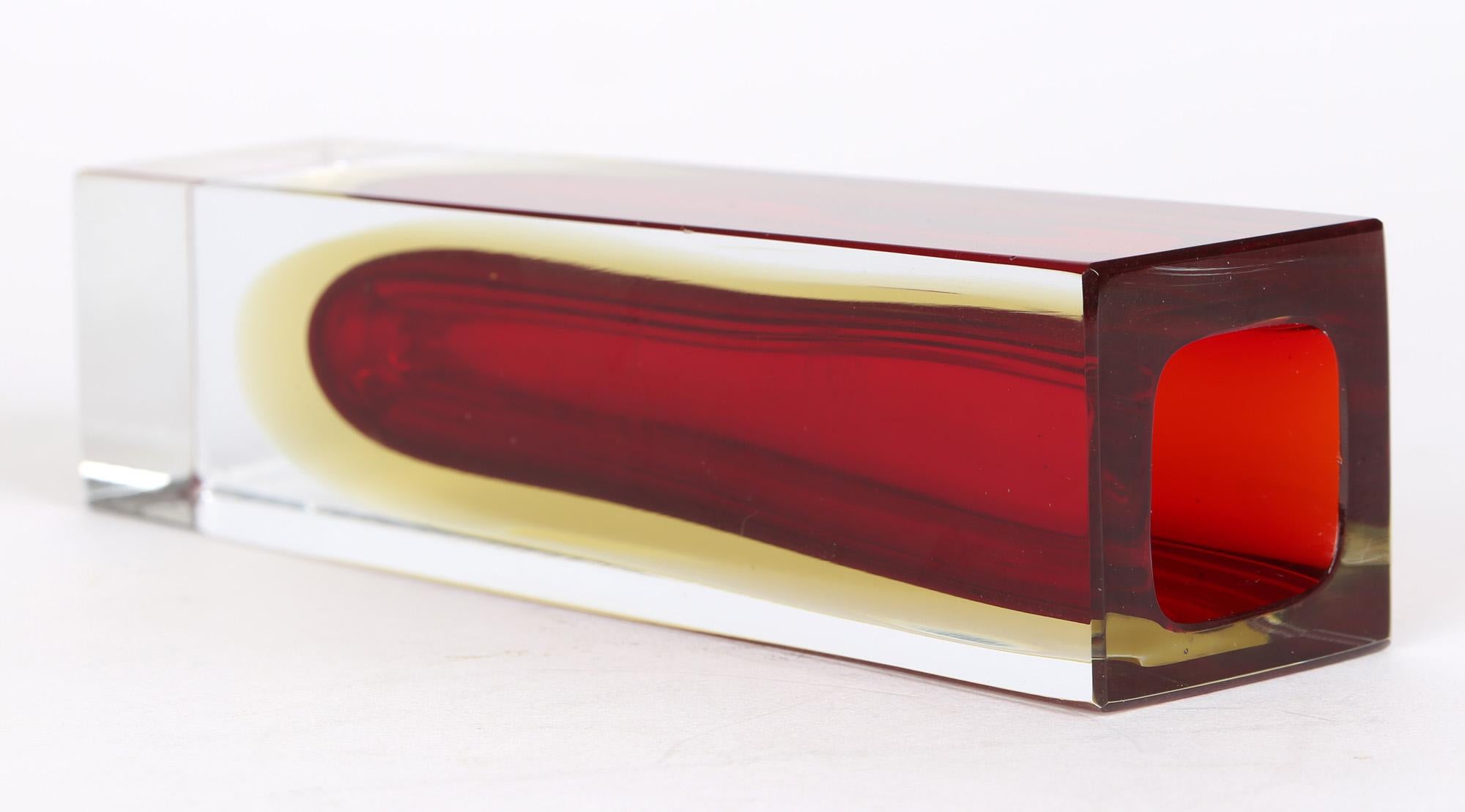 A quality vintage Murano sommerso red with yellow halo faceted glass vase attributed to Flavio Poli (1900-1984) for Seguso Vetri D'art and dating from around 1970. The vase is of square shape with tall rectangular shaped facet sides with a flat