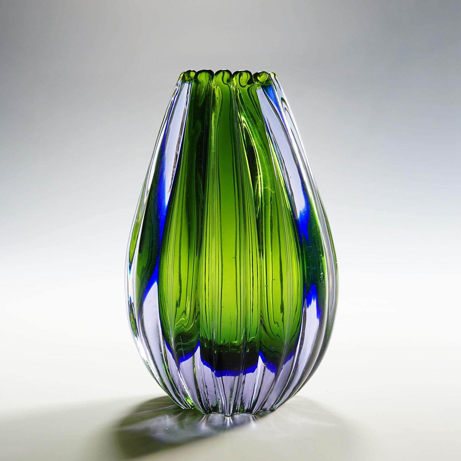Seguso Vetri d'Arte Murano Sommerso glass vase 1950s

A vintage Murano sommerso art glass vase. Designed by Flavio Poli and manufactured by Seguso Vetri d'Arte circa 1958. Seguso Model number 12024. Manufactured in thick violet glass with a blue
