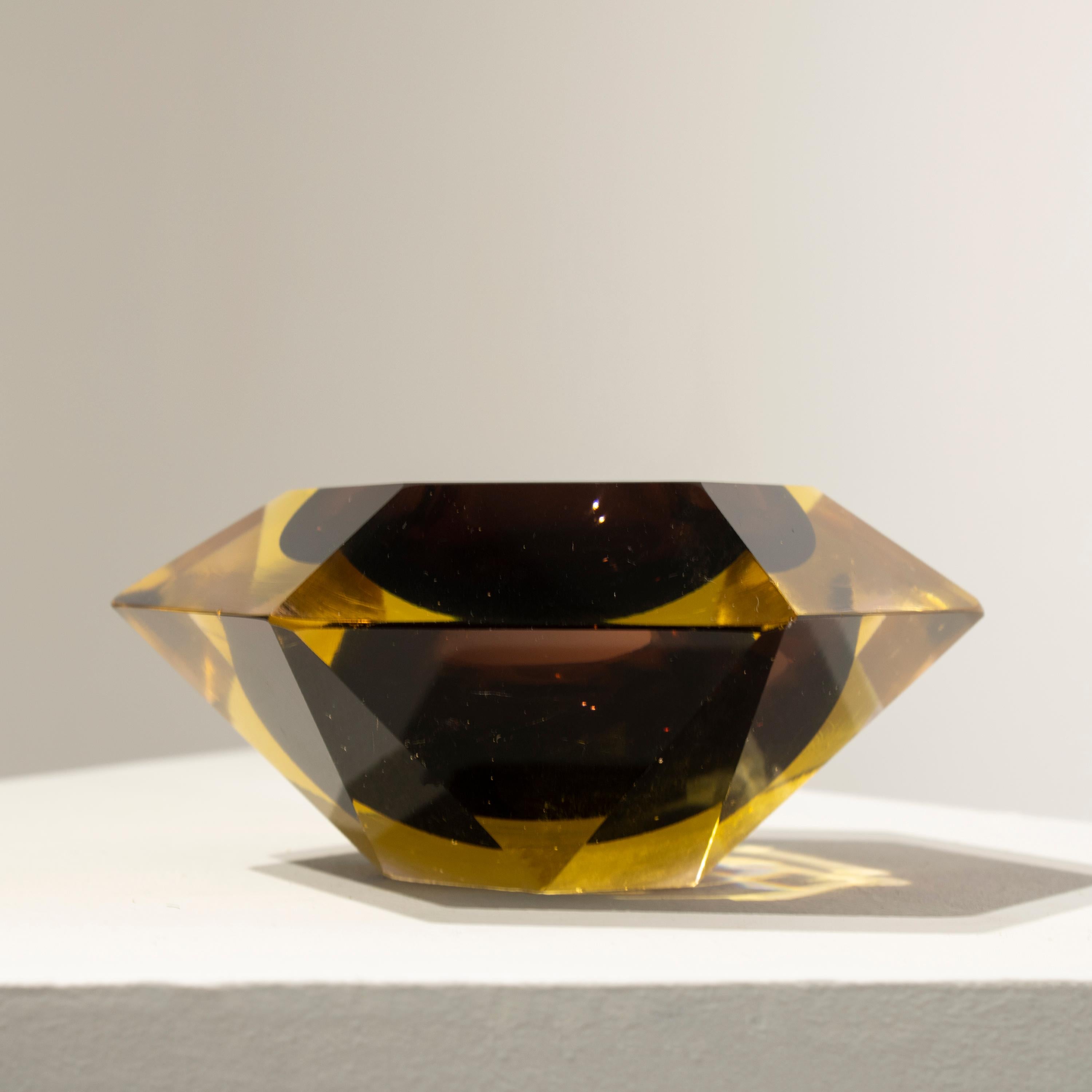 Italian small vase designed by Flavio Poli in the 1970´s. The vase is hand-crafted in faceted Murano glass with a polygonal shape, in different colors with predominant brown.