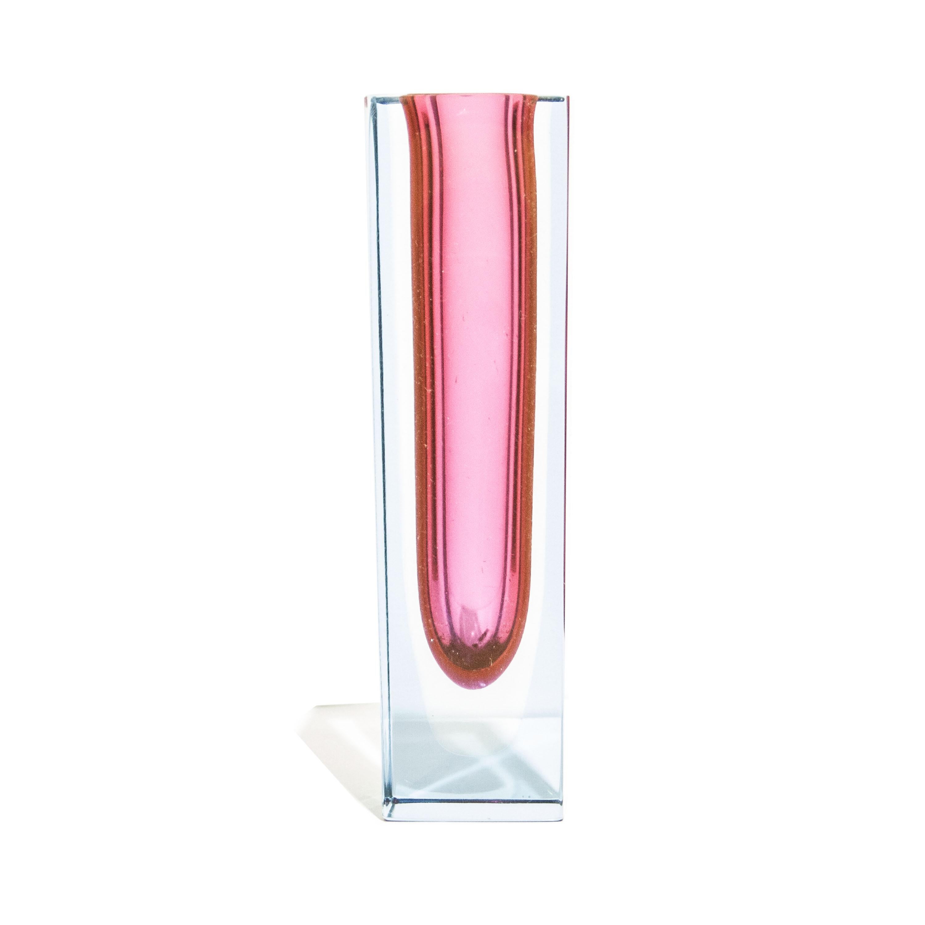 Italian small vase designed by Flavio Poli in the 1970´s. The vase is hand-crafted in faceted Murano glass in different colors with predominant pink.