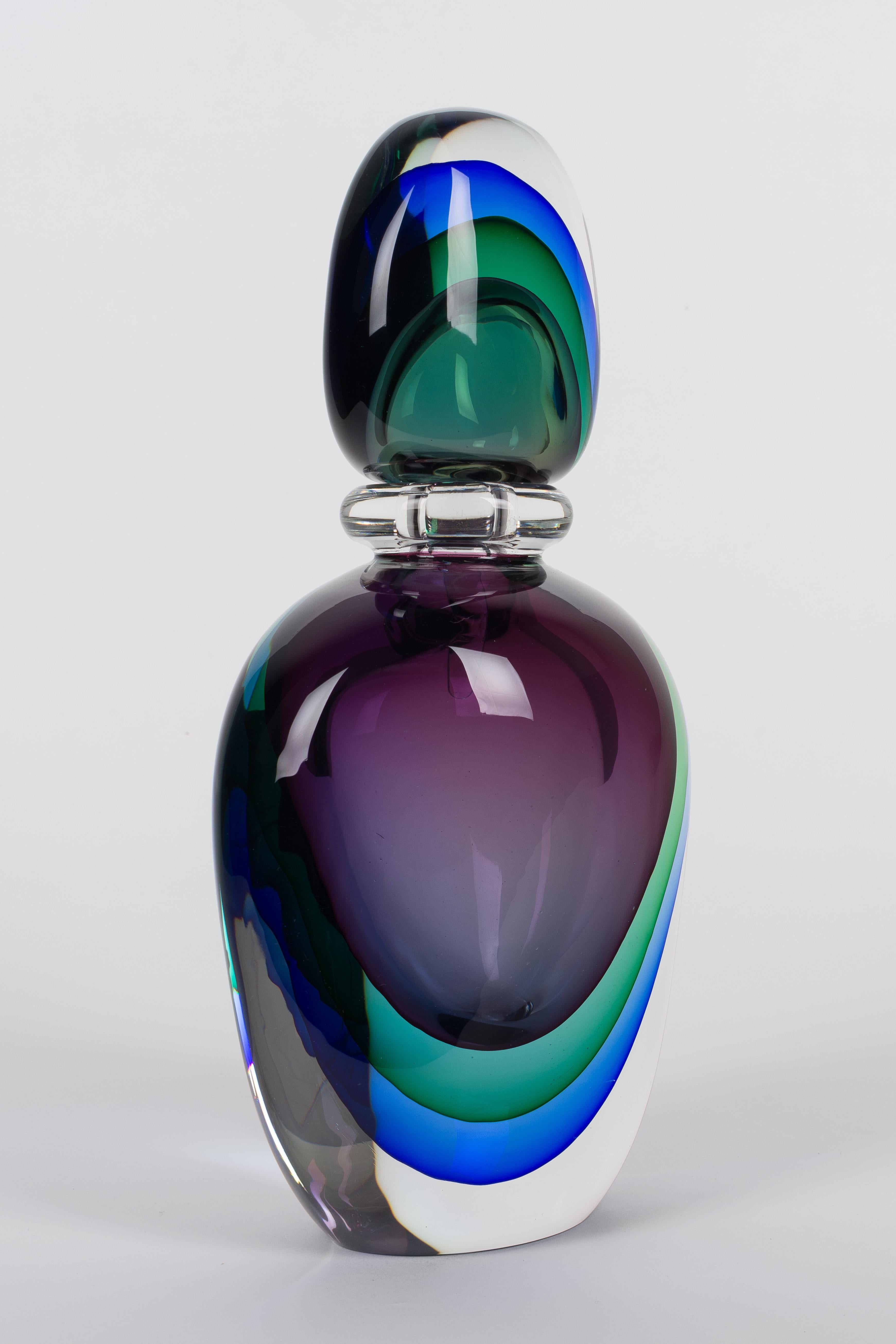 A large heavy Murano art glass sommerso presentation perfume bottle with stopper by Flavio Poli for Seguso. Three layers of sommerso vetri: blue, green and amethyst within a layer of clear glass. In excellent condition. Weight: 14.6 lbs.