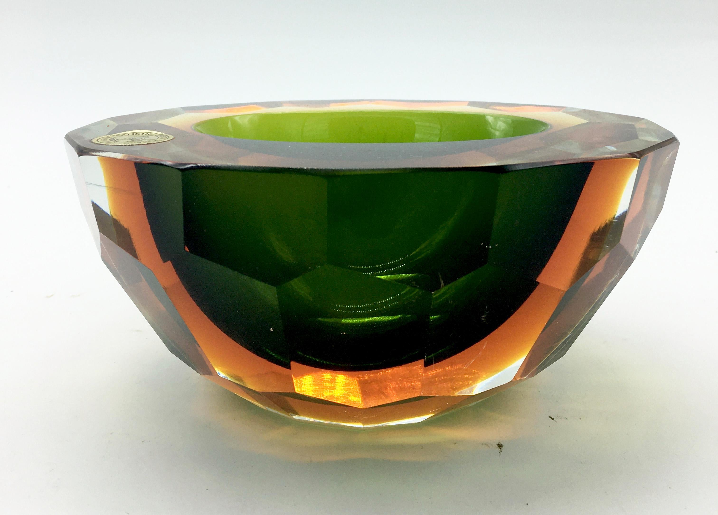 Stunning and incredible beautiful large ashtray by Flavio Poli for Seguso Vetri d’Arte, handcrafted according to the tradition of the major producers of the time.
The reflections of the colors change according to the light.
The amber color is