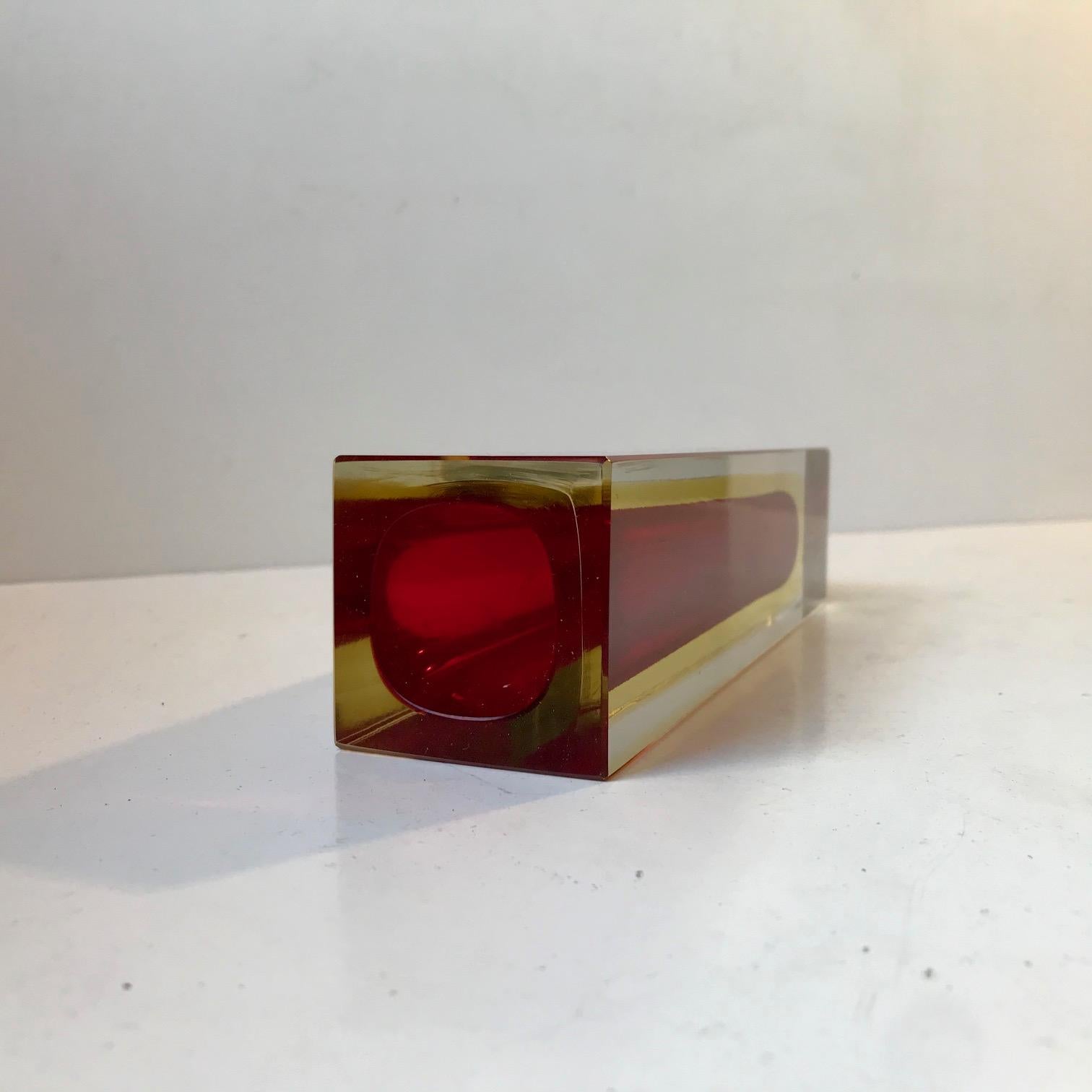 Square and gorgeous Flavio Poli double Sommerso Murano glass vase with red interior surrounded by yellow in a cased clear glass rectangular corpus. Made at Seguso in Italy circa 1960-70. Measure: Height: 20 cm.