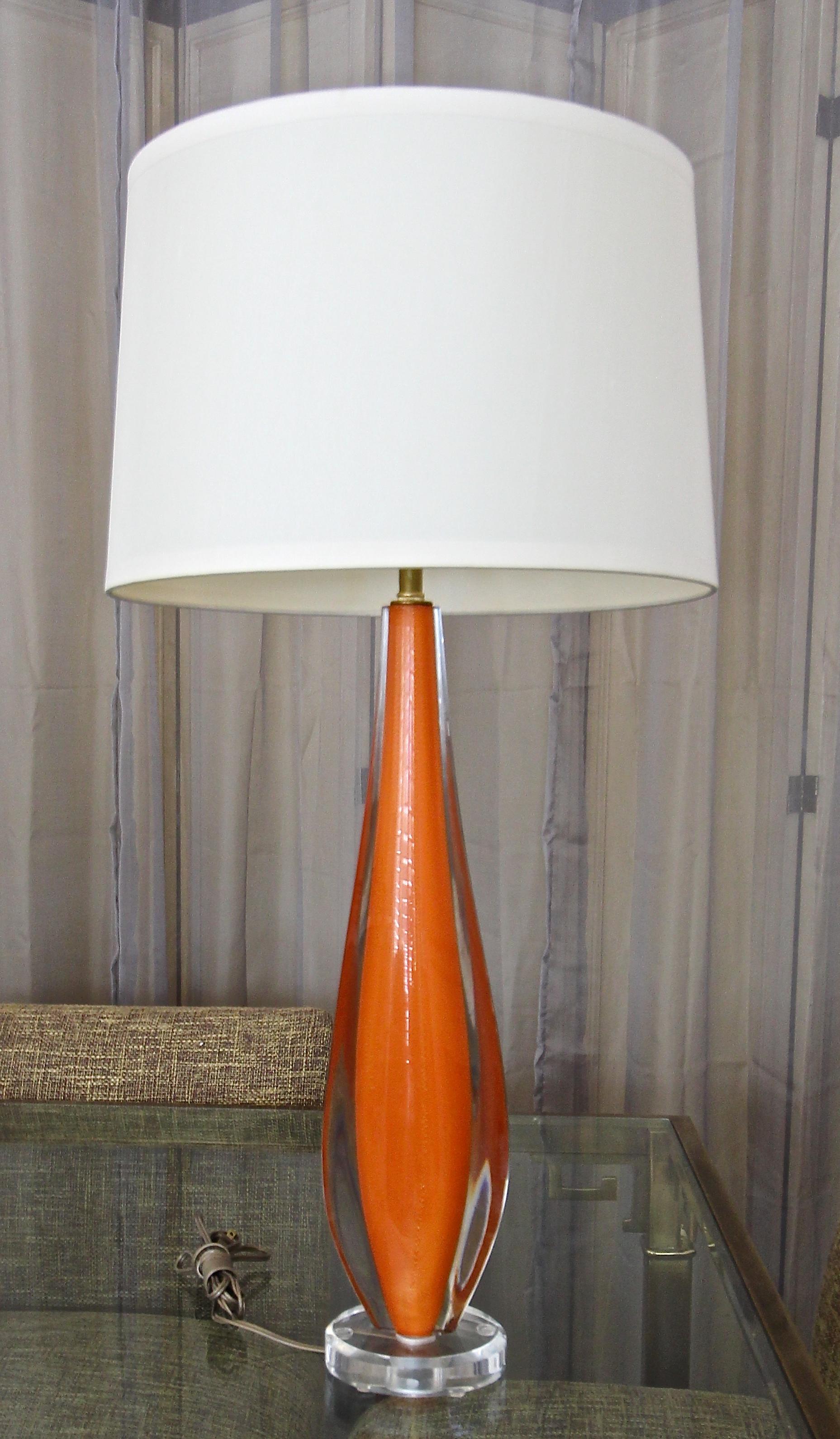 Single Italian hand blown orange colored glass with gold inclusions table lamp by Flavio Poli for Seguso. Mounted on new acrylic base. Newly wired with new solid brass 3-way socket. Measures: Glass portion 19.5