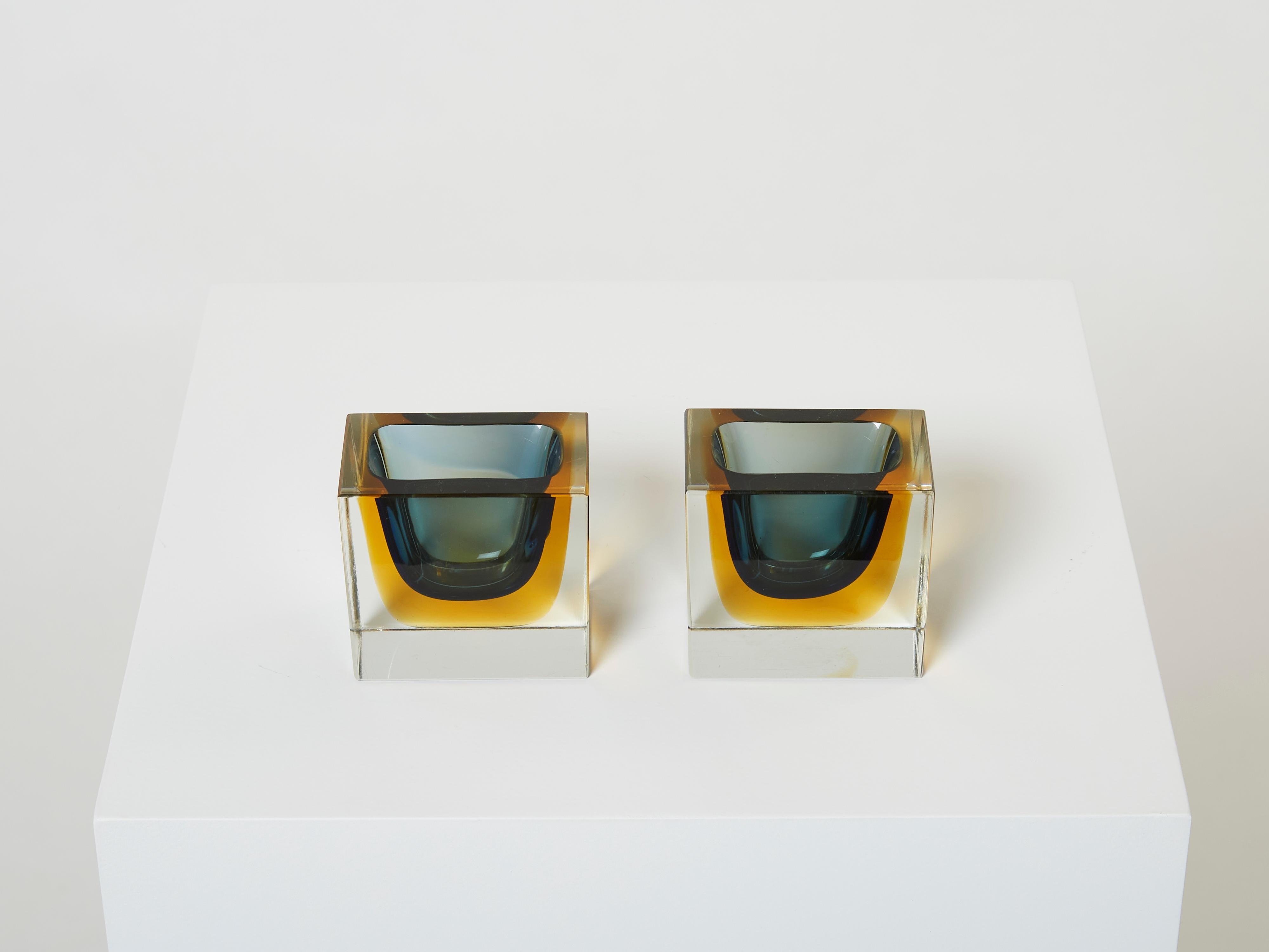 Beautiful pair of Flavio Poli small bowls or catch-all for Seguso Vetri D'Arte made in the 1960s from the Sommerso collection. These block bowls have eye-catching colors, with petrol blue glass submerged into yellow glass, finished with clear glass.