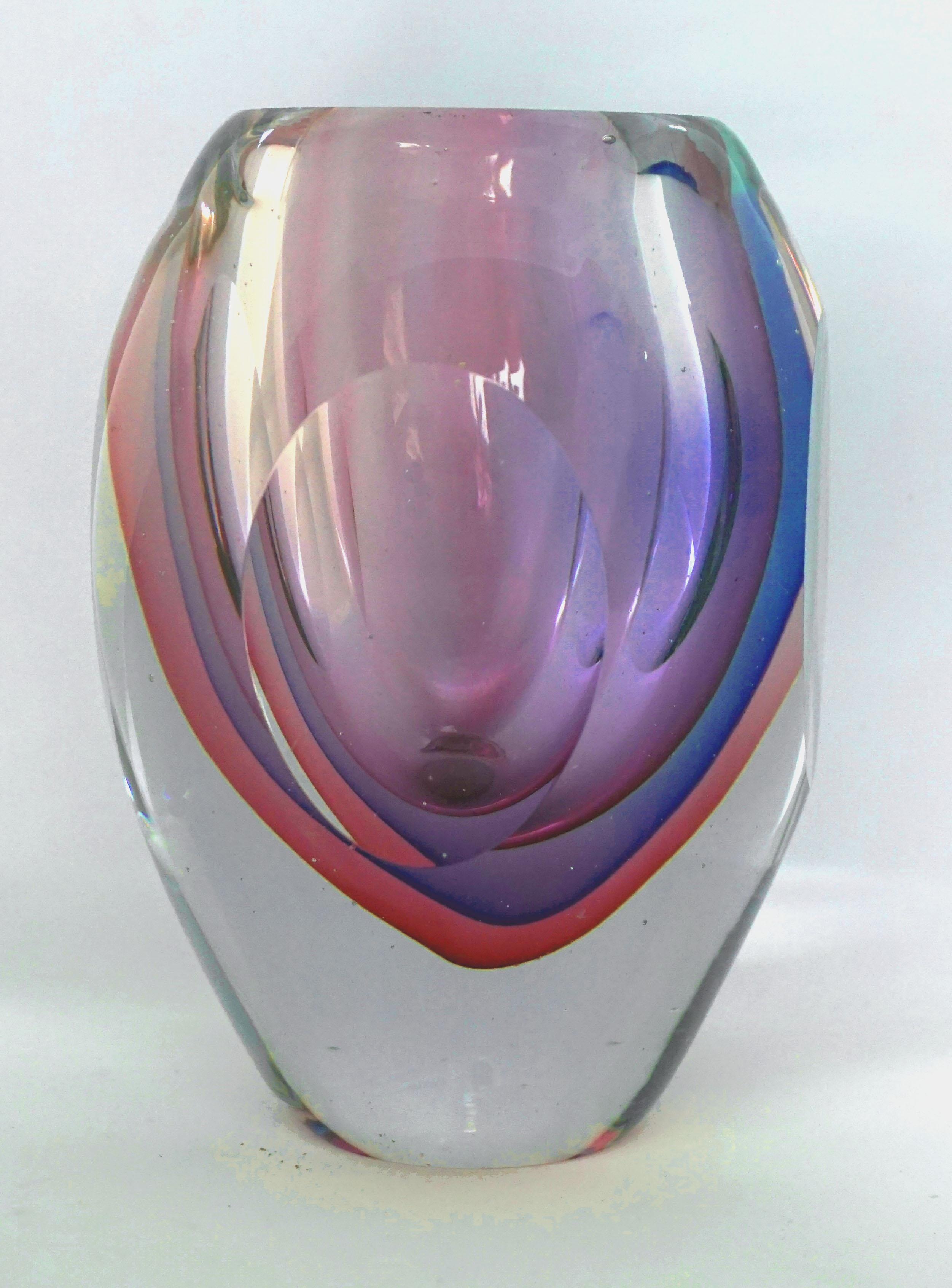 Stunning Venetian glass Sommerso vase designed by Flavio Poli for (Italian, 1900-1984) for Seguso Vetri d'Arte, dating from the 1960s. This faceted vase displays vibrant colors ranging from cobalt blue, purple and pink to clear. A fabulous example