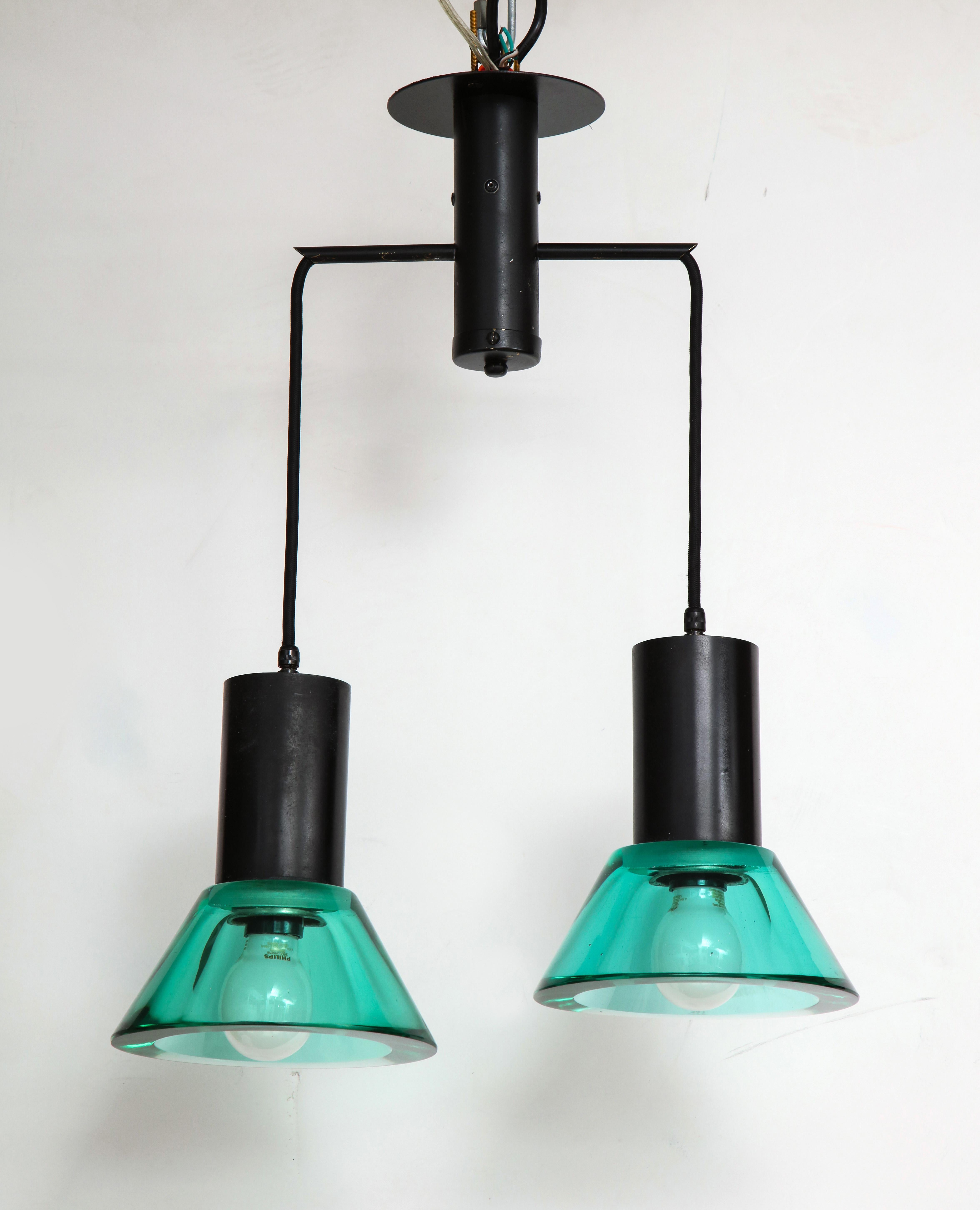 Flavio Poli Seguso dual suspension light, Venice, Italy, 1960s
Solid thick Murano glass, enamel, brass
Measures: H drop 1: 20” H drop 2”: 21” (can be adjusted)
Glass fixture height 8”, diameter 7”.