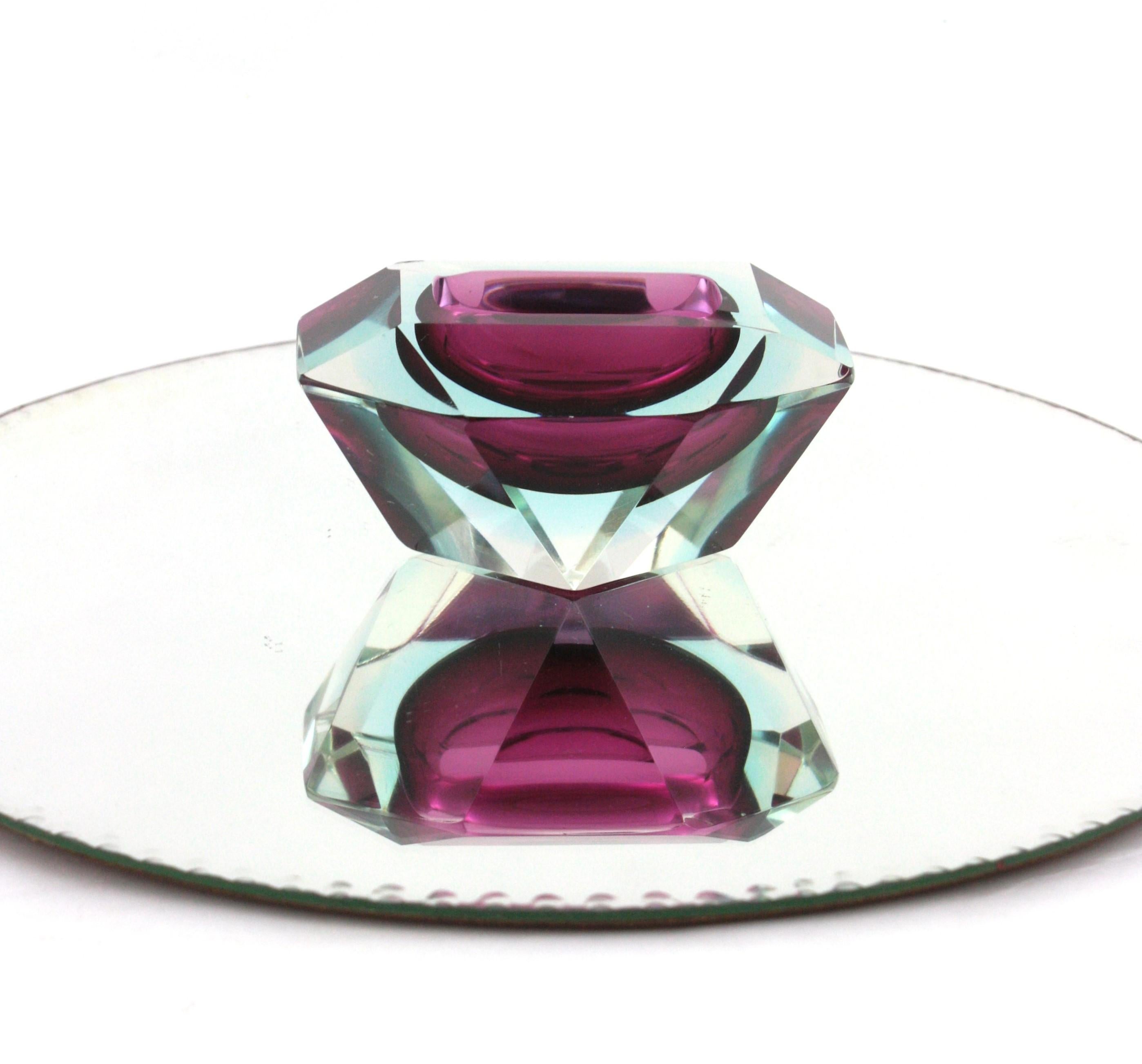 Mid-Century Modern Flavio Poli for Seguso Vetri d'Arte multi faceted purple and soft blue Murano glass Sommerso bowl, Italy, 1960s.
This hand blown glass bowl is made of purple glass and a layer of blue glass, submerged into clear glass. Designed