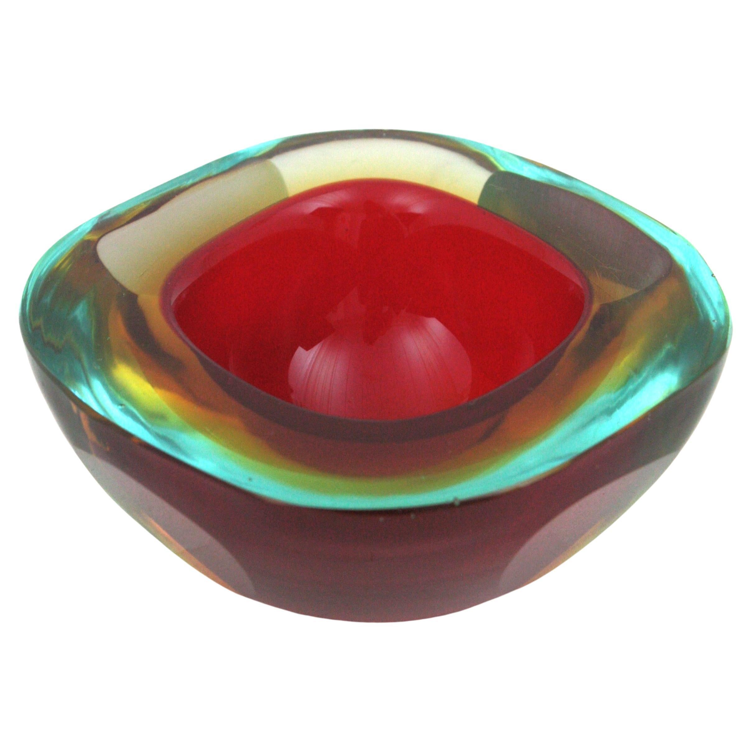 Italian Murano art glass square shaped geode bowl attributed to Flavio Poli for Seguso Vetri d'Arte. Italy, 1950s.
Beautiful hand blown Murano glass piece combining yellow, blue and red glass with Sommerso technique. 
This bowl can also be used as