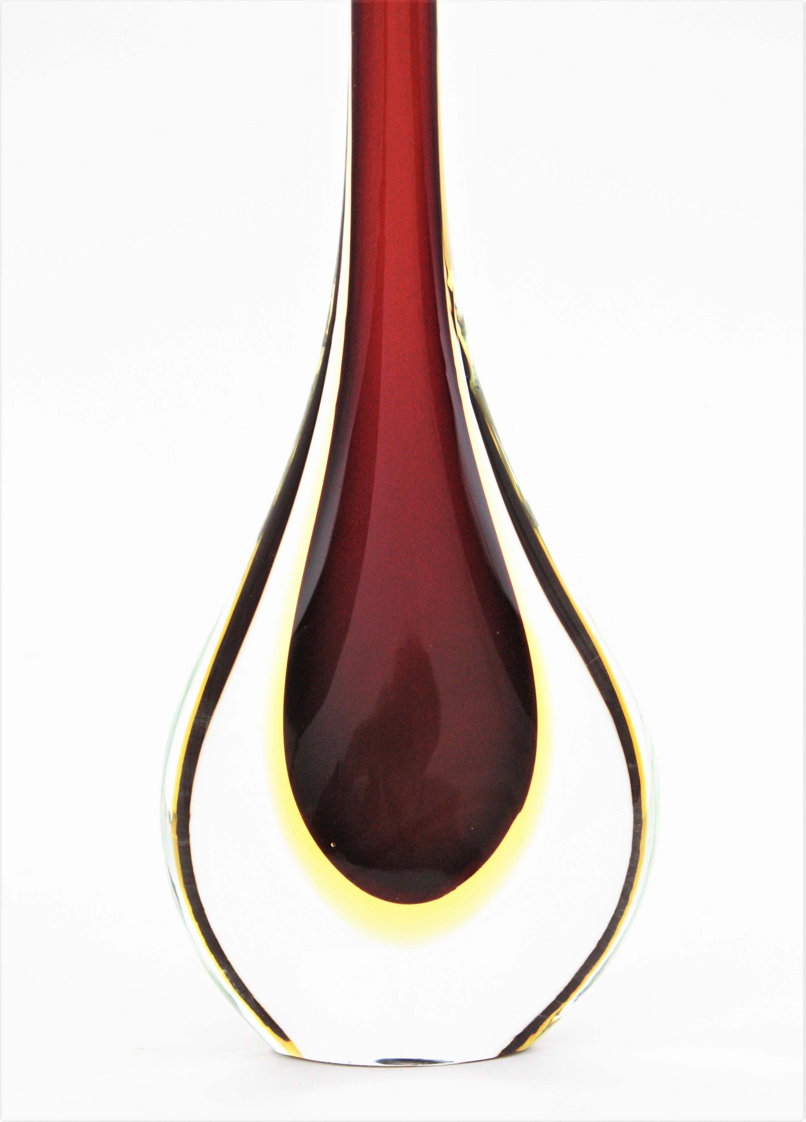 A wonderful Sommerso red and yellow hand blown Murano glass teardrop large vase. Designed by Flavio Poli and manufactured by Seguso Vetri d'Arte, Italy, 1950s.
Amazing teardrop shape with tall neck and eye-catching colors. Red glass submerged into