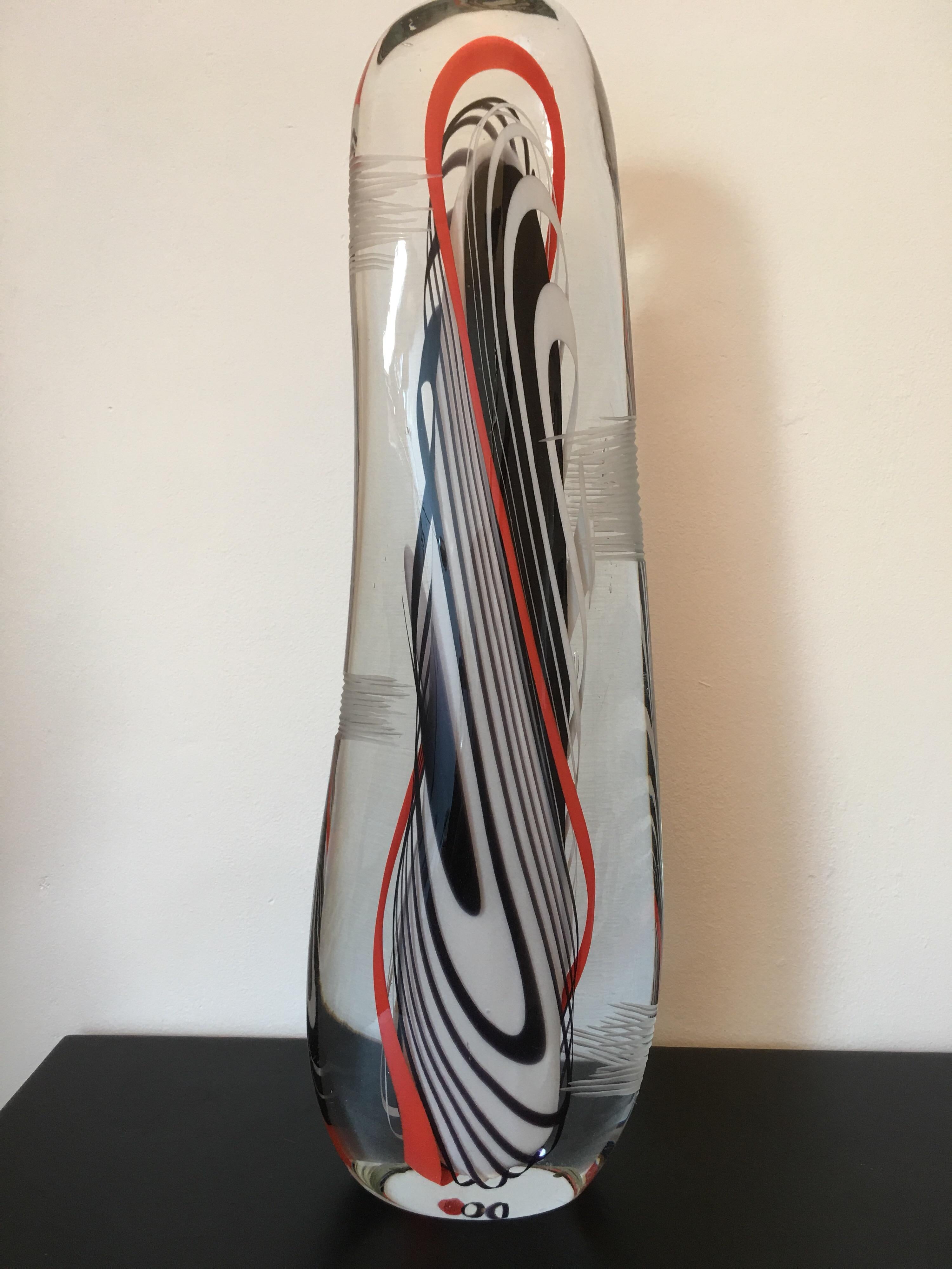 A very tall art glass sculpture made by Flavio Poli in Italy in 1979.
Abstract form composed of layers of red, white and black glass.
F POLI 79 marked
Flavio Poli, Murano (1900-1984) was a famous artist, known for his designs in glass. He was