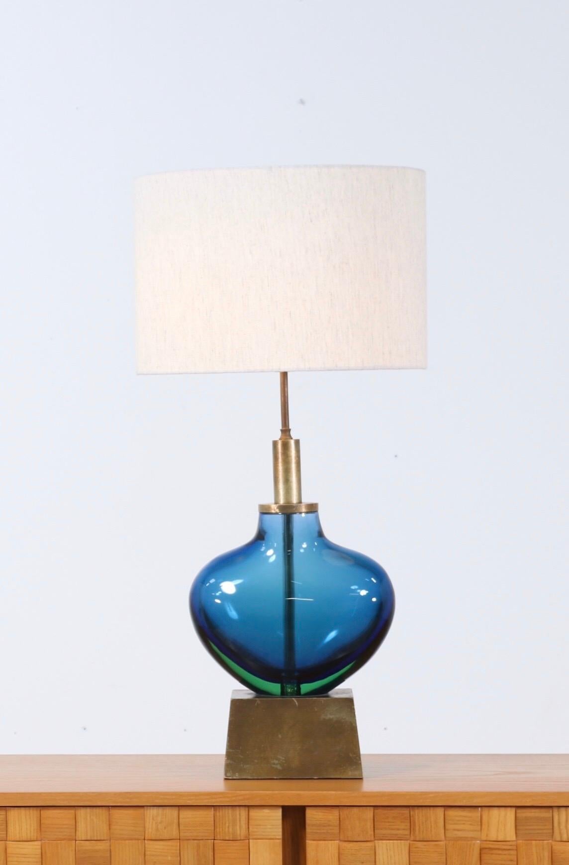 Fantastic, 1950s Italian Murano glass lamp designed by Flavio Poli for Seguso, Italy.

The lamp consists of a beautiful and substantial mouth-blown glass body mounted on a gilt-wood base. The design is executed using the Sommerso technique.