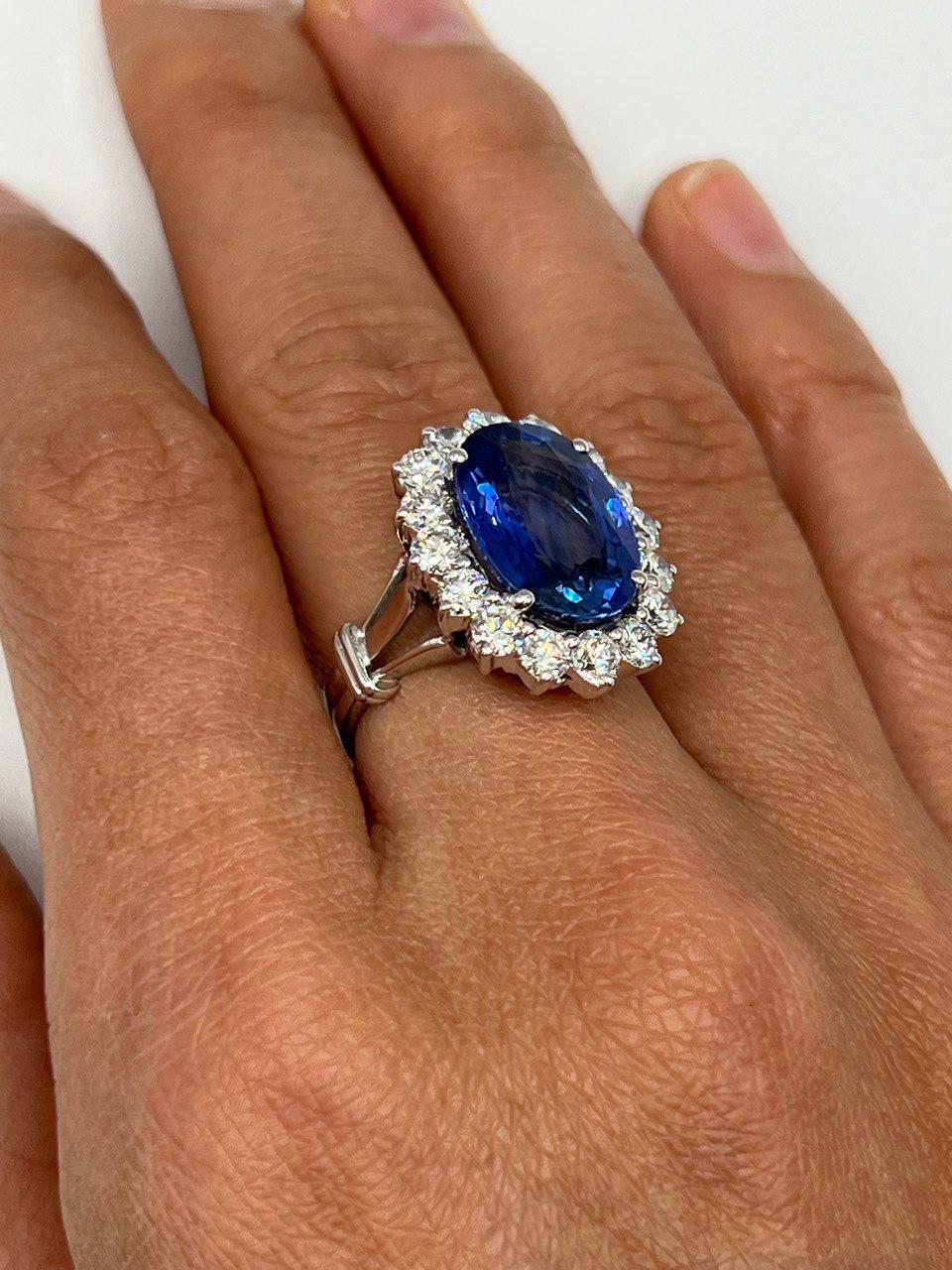 beautiful 18k white gold ring with natural untreated 8.09 carat blue sapphire ; this stone is from Sri Lanka.
the main stone surrounded by 1.60 carat round diamonds.
the diamonds are F-G color and Vs in clarity.
