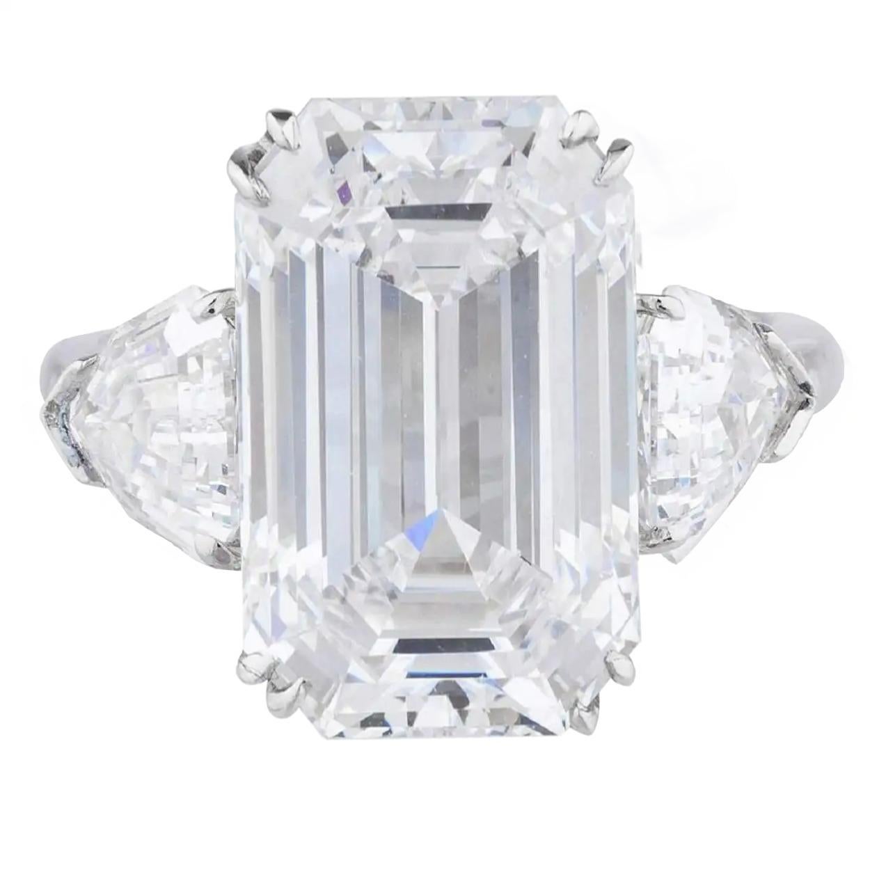 The main stone is an amazing quality Gia Certified 3 Carat Emerald Cut Diamond D Color FLAWLESS Clarity
