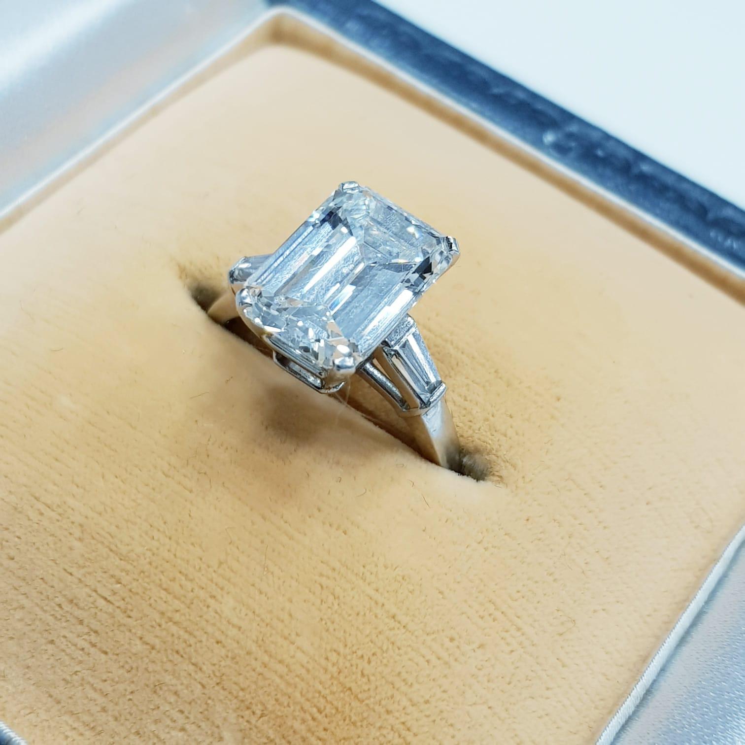 delicate emerald cut engagement ring