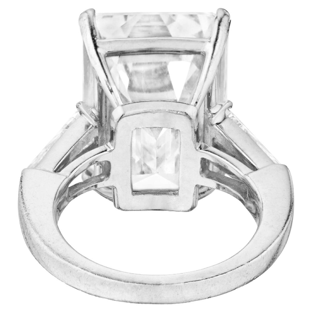 Introducing a breathtaking masterpiece that epitomizes sophistication and grace – a 5-carat emerald-cut diamond ring of extraordinary beauty. This magnificent jewel is a testament to the union of impeccable craftsmanship and timeless design.

Main